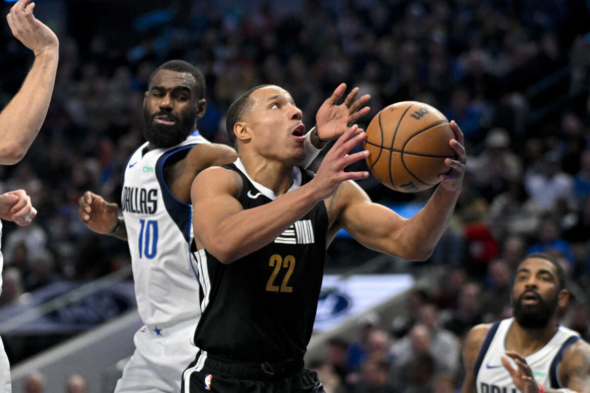Jan 9, 2024; Dallas, Texas, USA; Memphis Grizzlies guard Desmond Bane (22) is fouled by Dallas Mavericks forward Tim Hardaway Jr. (10) during the second half at the American Airlines Center. Mandatory Credit: Jerome Miron-USA TODAY Sports