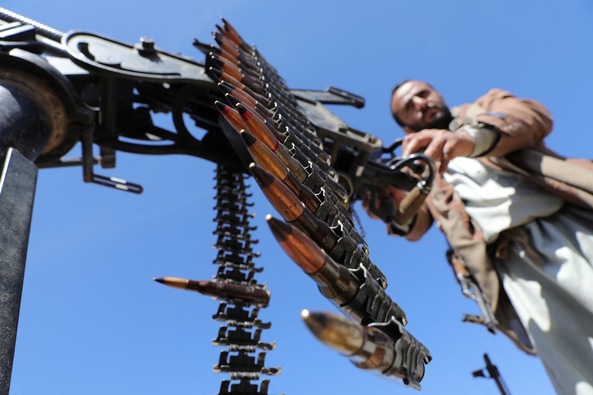 A Tribesman loyal to the Houthis mans a machine gun mounted on a pick-up truck during a military parade for new tribal recruits amid escalating tensions with the U.S.-led coalition in the Red Sea, in Bani Hushaish, Yemen January 22, 2024. REUTERS