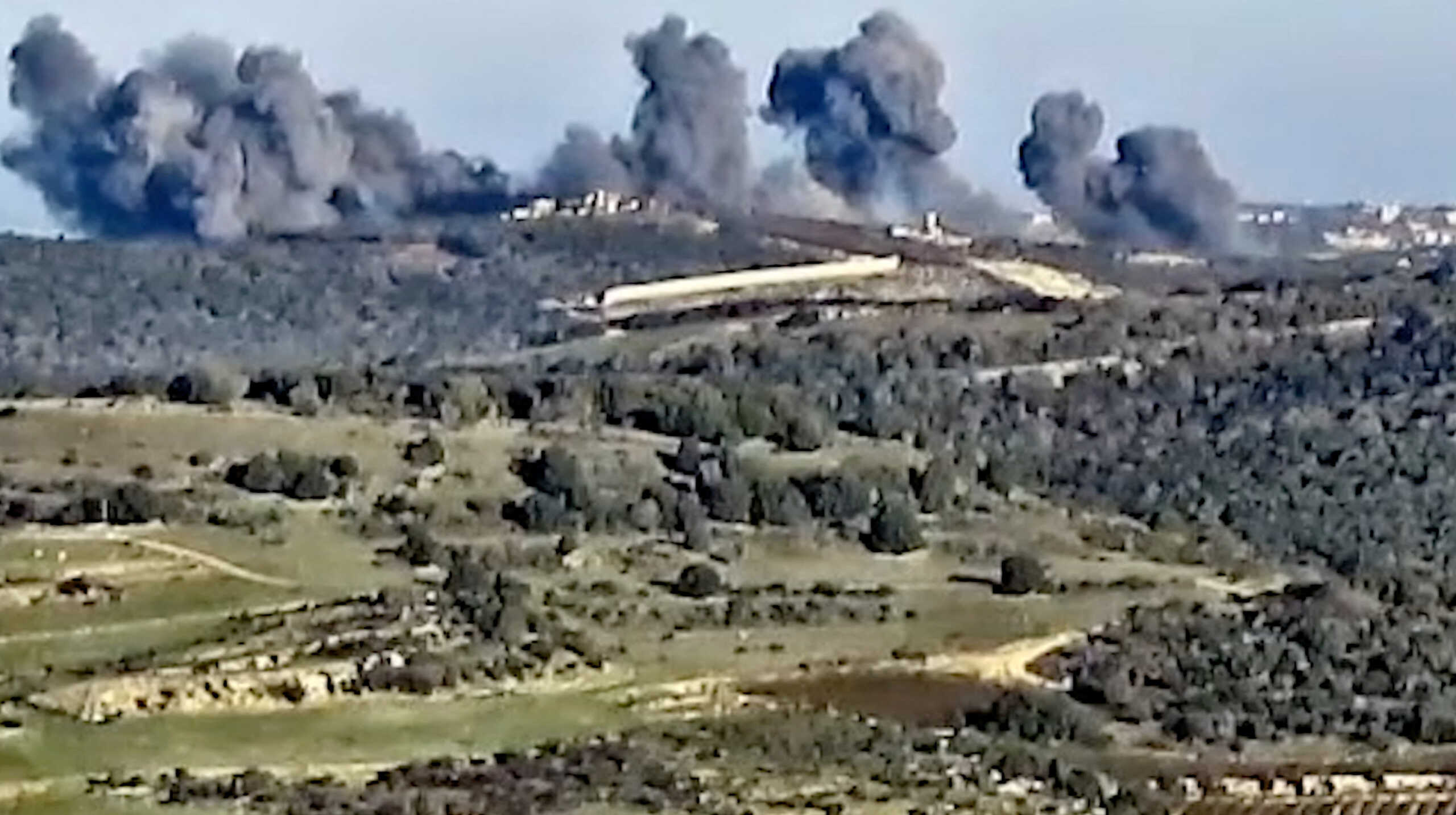 Smoke rises following what the Israeli military says is an Israeli strike on Hezbollah targets in a location given as Lebanon, amid the ongoing cross-border hostilities between Hezbollah and Israeli forces, in this screengrab taken from a handout video released on December 20, 2023. Israel Defense Forces