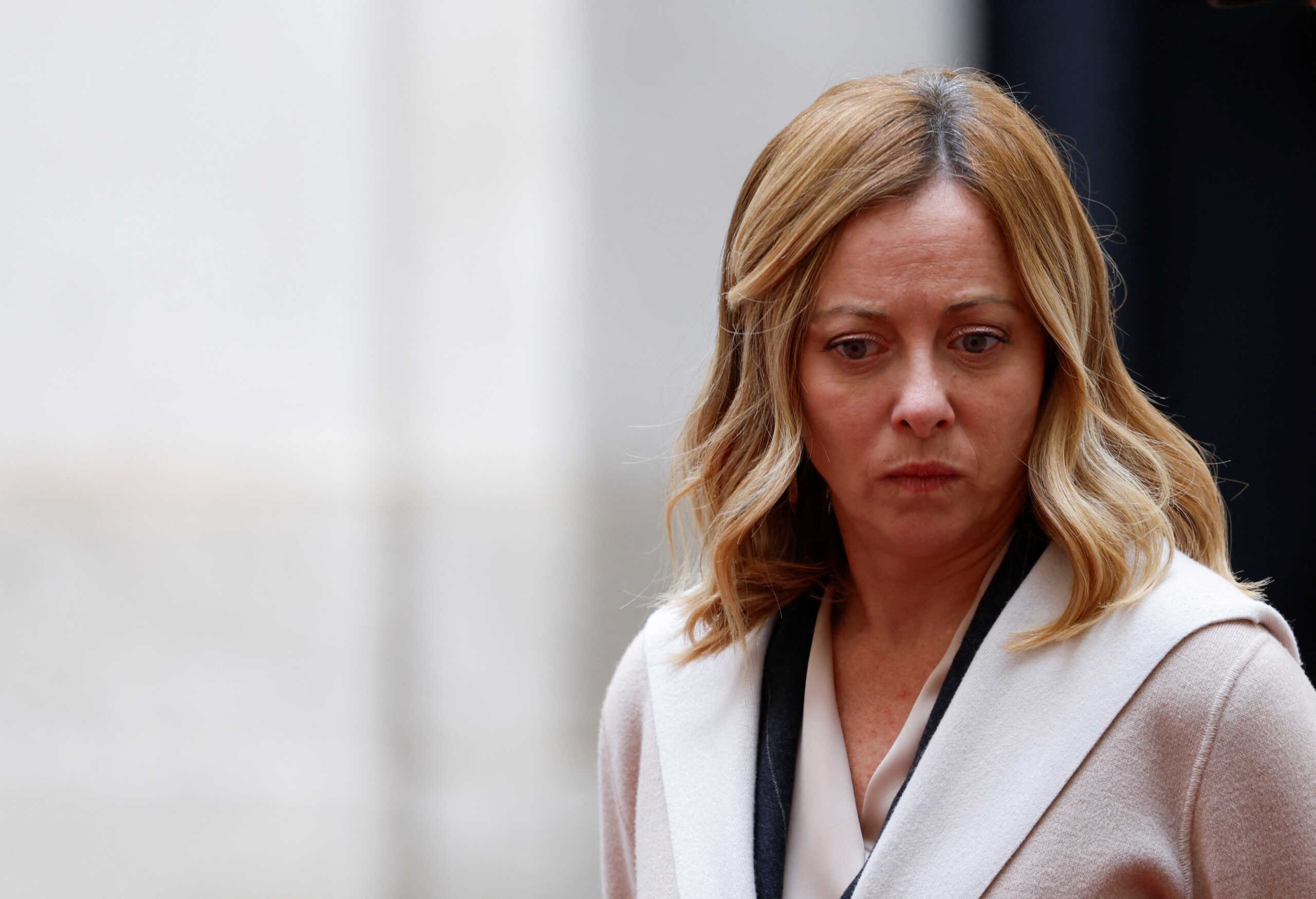Italian Prime Minister Giorgia Meloni looks on as she waits to meet European Parliament President Roberta Metsola at Palazzo Chigi, in Rome, Italy, December 6, 2023. REUTERS