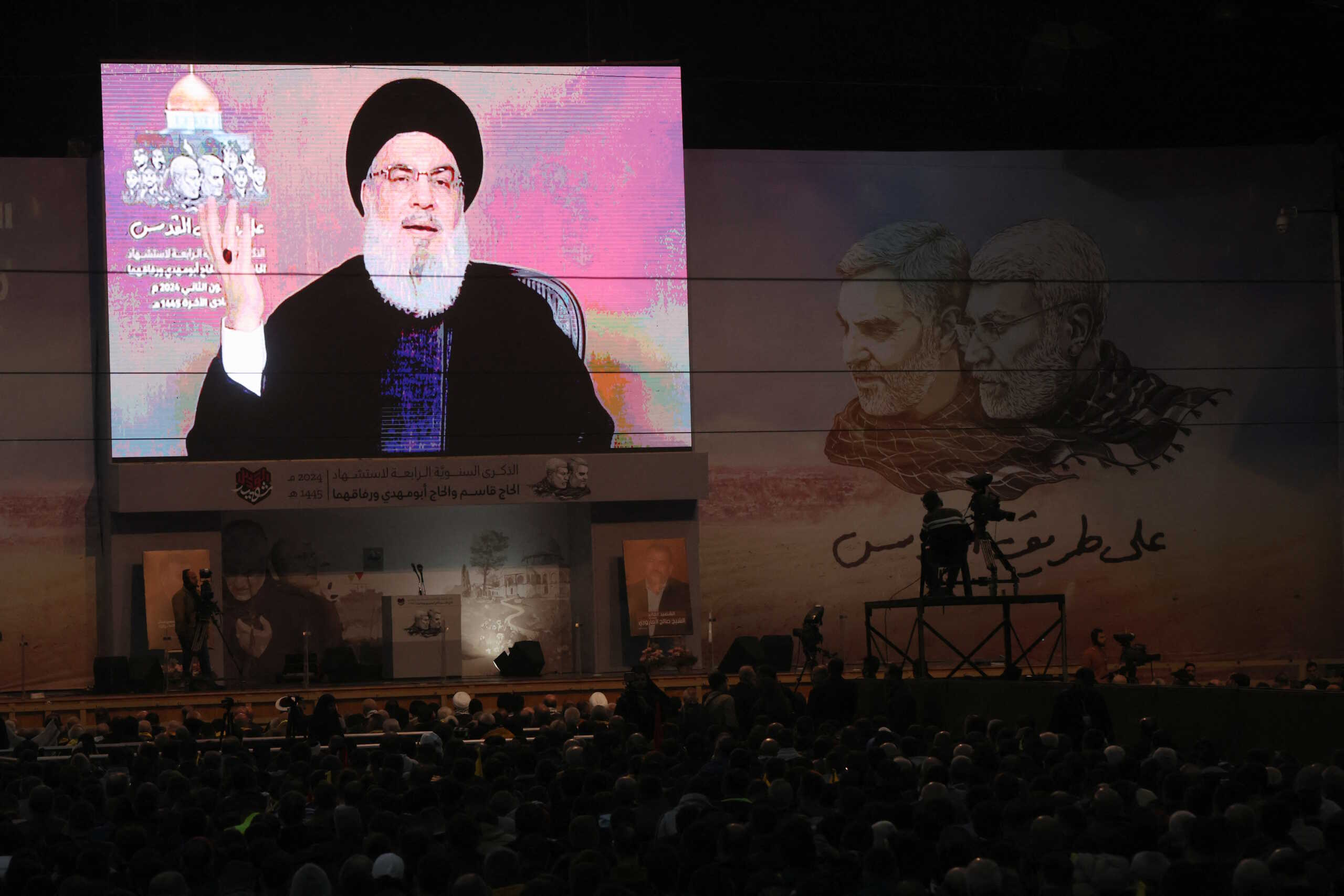 Lebanon's Hezbollah leader Sayyed Hassan Nasrallah addresses his supporters through a screen during a ceremony to mark the fourth anniversary of the killing of senior Iranian military commander General Qassem Soleimani in a U.S. attack, in Beirut's southern suburbs, Lebanon January 3, 2024. REUTERS