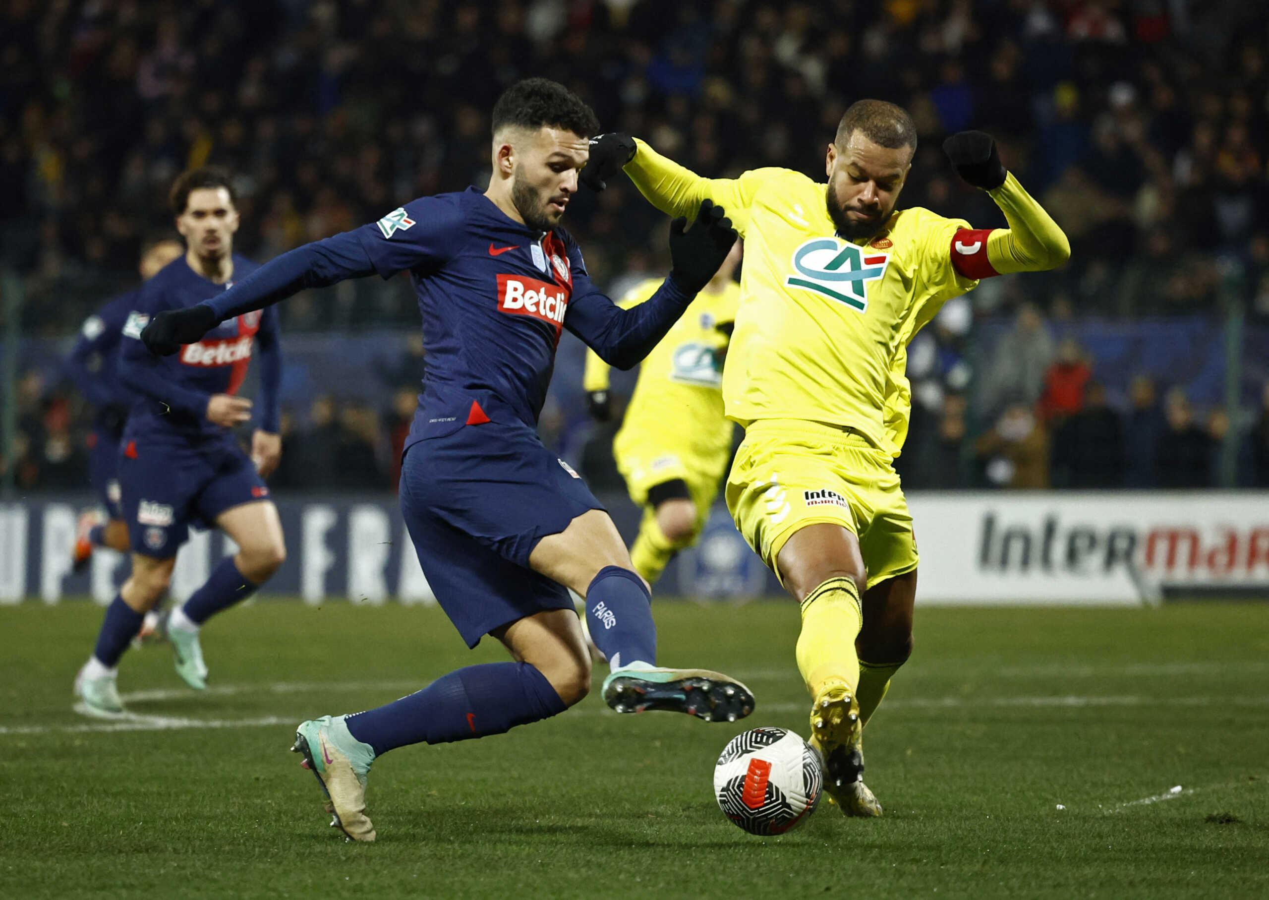 Soccer Football - Coupe de France - Round of 32 - US Orleans v Paris St Germain - Stade de la Source, Orleans, France - January 20, 2024 Paris St Germain's Goncalo Ramos in action with Orleans' Nicholas Saint-Ruf REUTERS