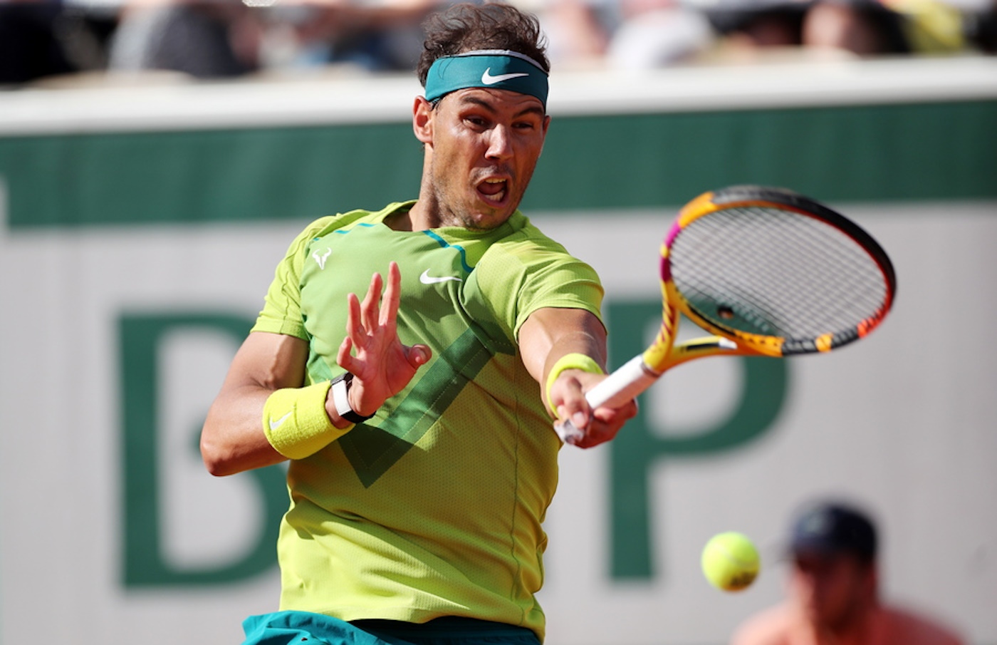 epa09980269 Rafael Nadal of Spain hits a forehand in the men's third round match against Botic van de Zandschulp of the Netherlands during the French Open tennis tournament at Roland Garros in Paris, France, 27 May 2022.  EPA