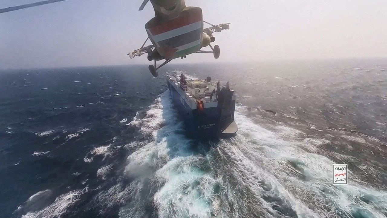 FILE PHOTO: Houthi military helicopter flies over the Galaxy Leader cargo ship in the Red Sea in this photo released November 20, 2023. Houthi Military Media