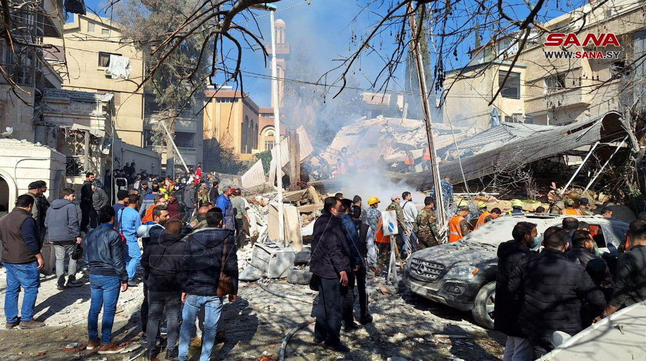 People inspect the damage at the site of an Israeli strike, according to sources,  in the Mazzeh neighborhood of Damascus, Syria  January 20, 2024. SANA