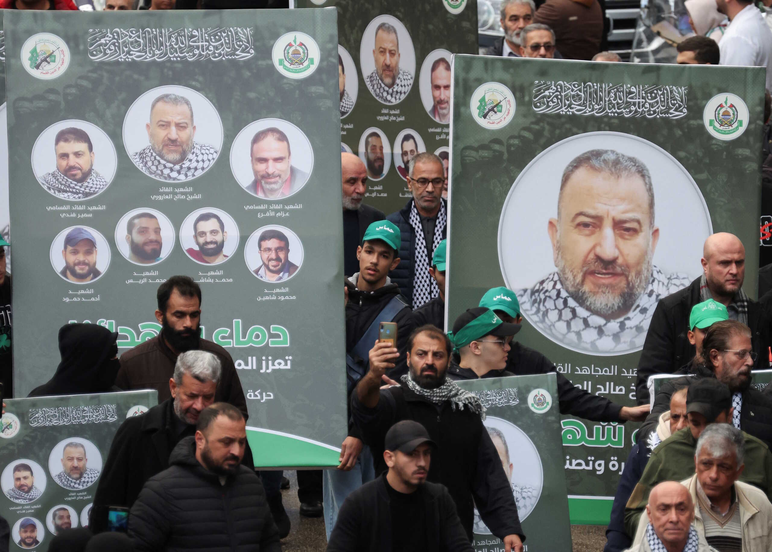 People carry placards with pictures of deputy head of Hamas, Saleh al-Arouri, who was killed by what Lebanese and Palestinian security sources say was a drone strike by Israel, as mourners gather during his funeral in Beirut, Lebanon January 4, 2024. Israel has neither confirmed nor denied that it killed Arouri in the attack. REUTERS