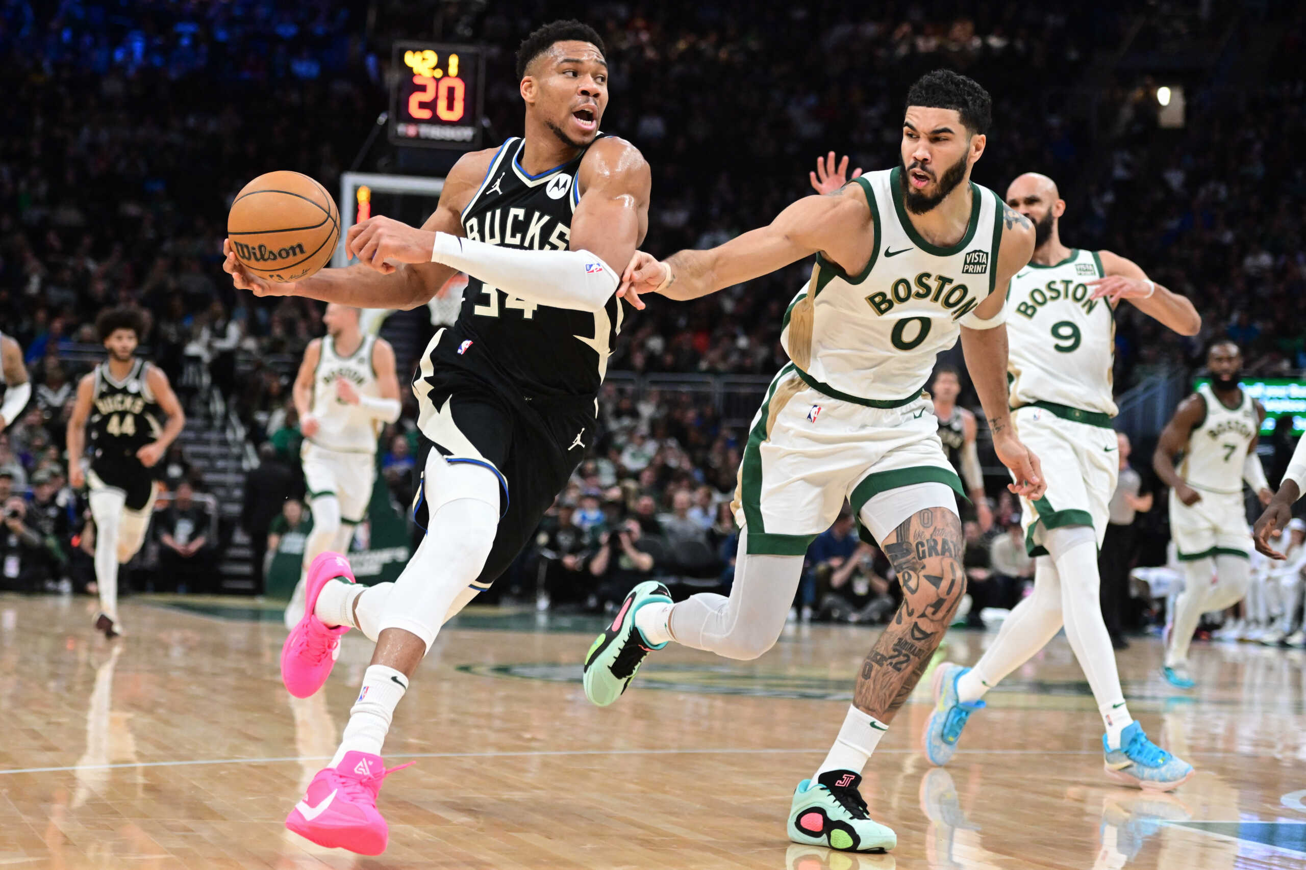 Jan 11, 2024; Milwaukee, Wisconsin, USA; Milwaukee Bucks forward Giannis Antetokounmpo (34) drives for the basket against Boston Celtics forward Jayson Tatum (0) in the second quarter at Fiserv Forum. Mandatory Credit: Benny Sieu-USA TODAY Sports