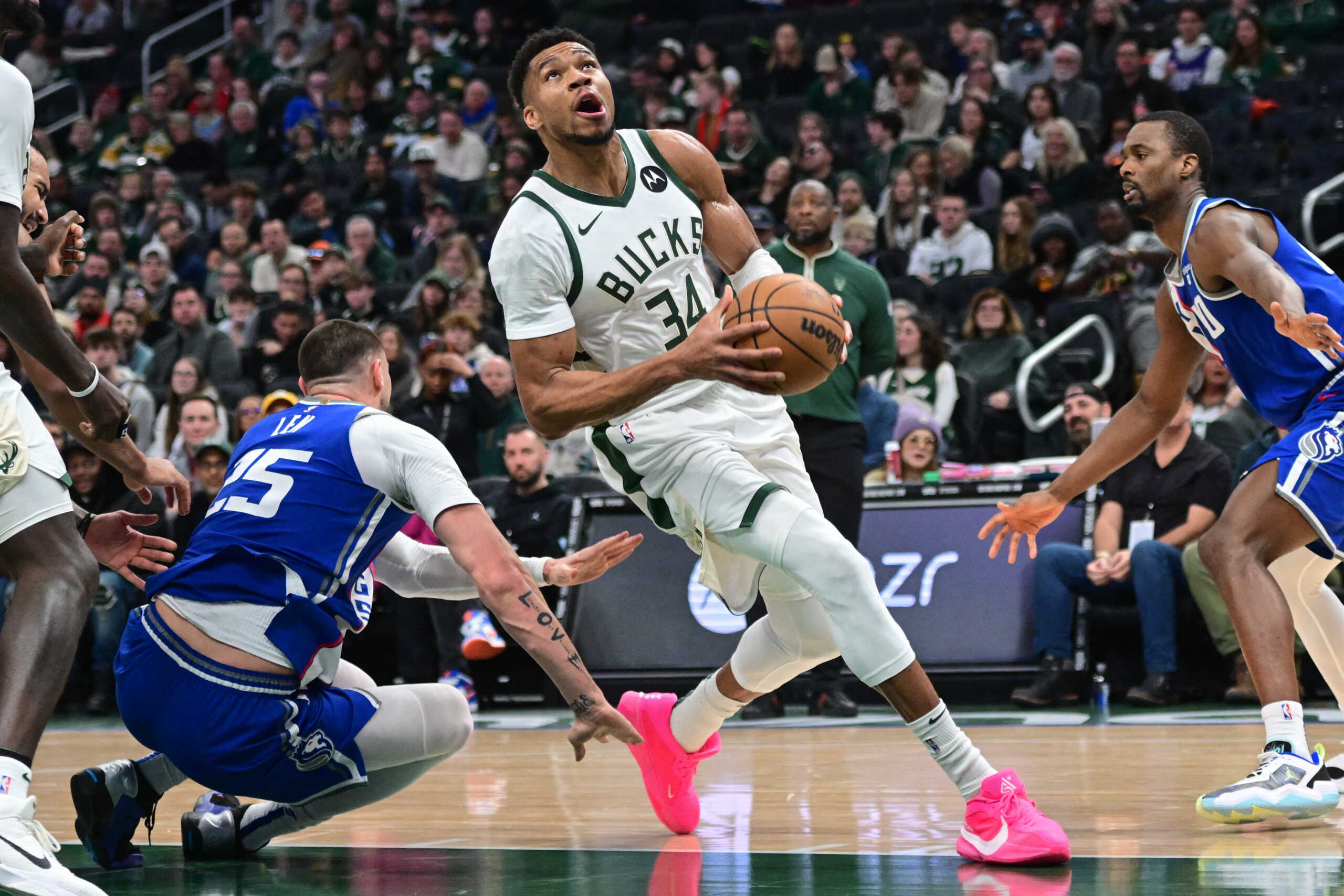 Jan 14, 2024; Milwaukee, Wisconsin, USA; Milwaukee Bucks forward Giannis Antetokounmpo (34) drives for the basket against Sacramento Kings center Alex Len (25) in the second quarter at Fiserv Forum. Mandatory Credit: Benny Sieu-USA TODAY Sports