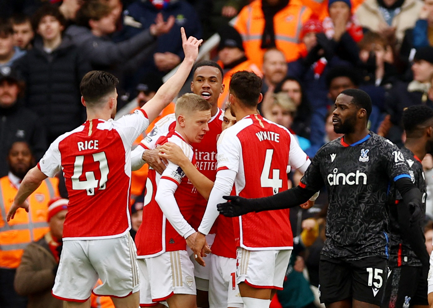 Soccer Football - Premier League - Arsenal v Crystal Palace - Emirates Stadium, London, Britain - January 20, 2024 Arsenal's Gabriel celebrates their second goal with teammates as Crystal Palace's Jeffrey Schlupp reacts REUTERS
