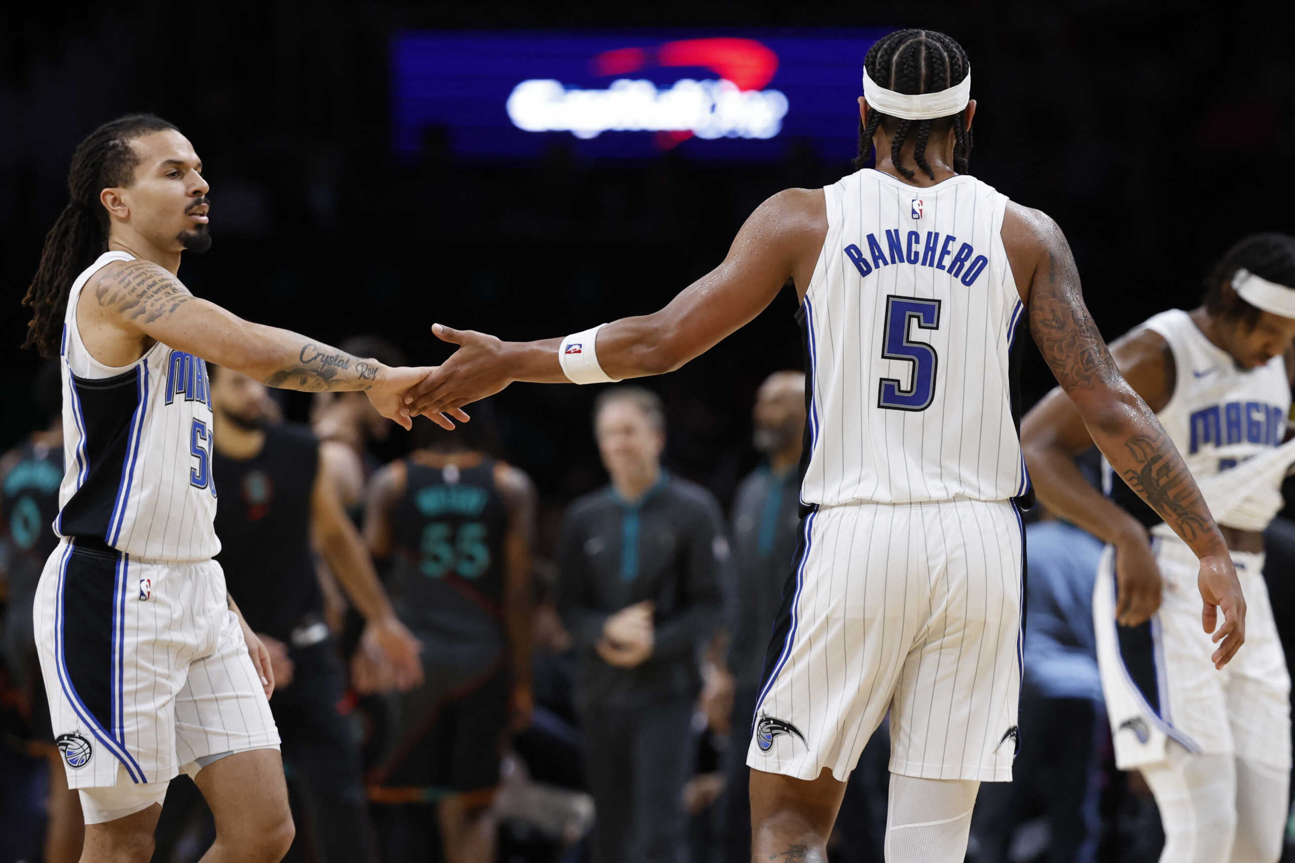 Dec 26, 2023; Washington, District of Columbia, USA; Orlando Magic forward Paolo Banchero (5) celebrates with Orlando Magic guard Cole Anthony (50) against the Washington Wizards in the third quarter at Capital One Arena. Mandatory Credit: Geoff Burke-USA TODAY Sports
