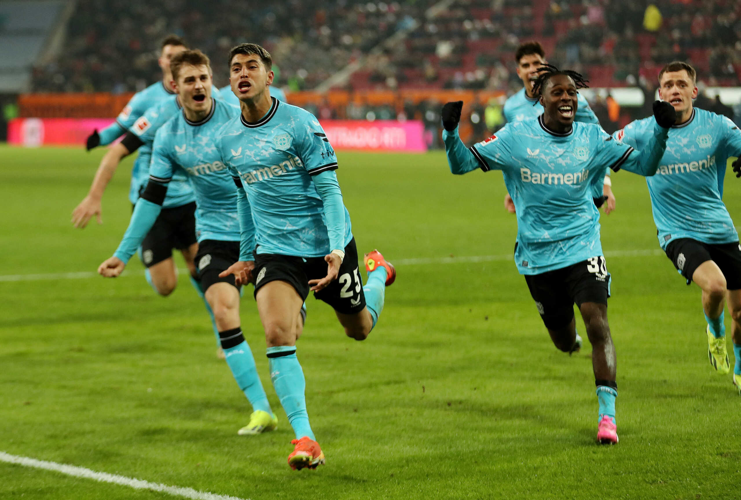 Soccer Football - Bundesliga - FC Augsburg v Bayer Leverkusen - WWK Arena, Augsburg, Germany - January 13, 2024 Bayer Leverkusen's Exequiel Palacios celebrates scoring their first goal with Jeremie Frimpong REUTERS