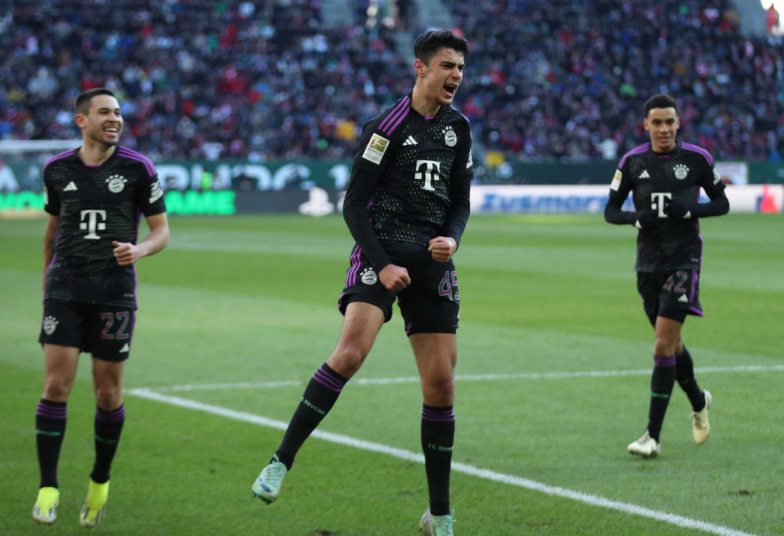 Soccer Football - Bundesliga - FC Augsburg v Bayern Munich - WWK Arena, Augsburg, Germany - January 27, 2024 Bayern Munich's Aleksander Pavlovic celebrates scoring their first goal REUTERS