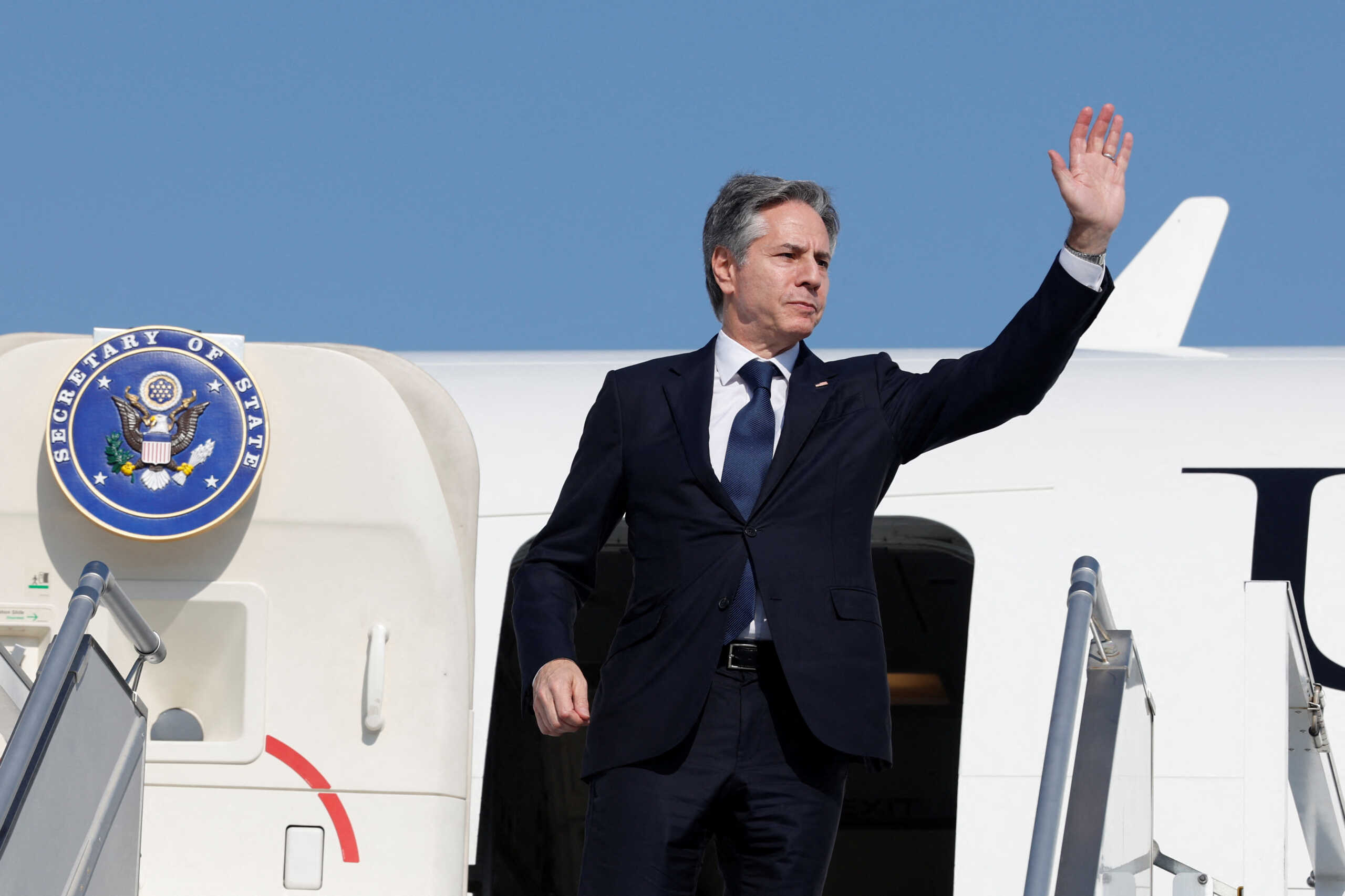 U.S. Secretary of State Antony Blinken waves as he departs for Saudi Arabia, during his week-long trip aimed at calming tensions across the Middle East, in Abu Dhabi, United Arab Emirates, January 8, 2024. REUTERS