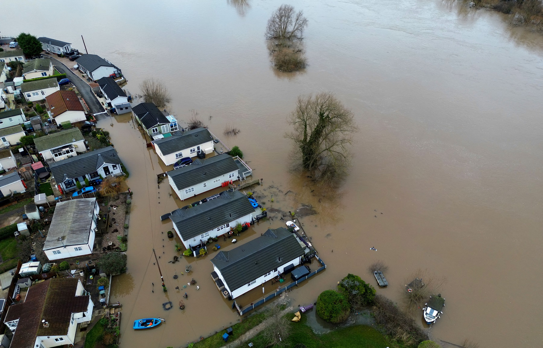 Houses in Radcliffe-on-Trent are surrounded by flood water after heavy rain from Storm Henk, Radcliffe-on-Trent, Nottinghamshire, Britain, January 5, 2024. REUTERS