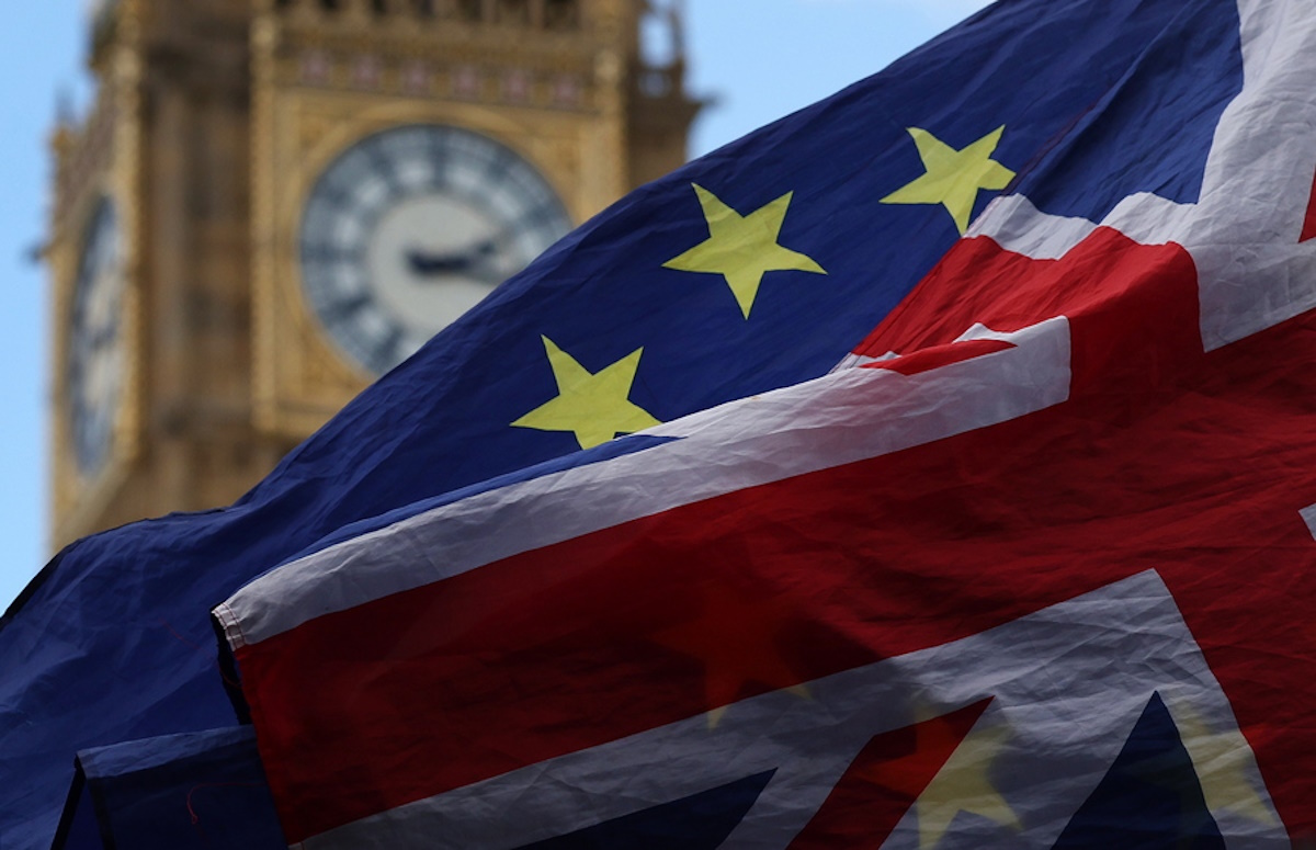 epa10727699 A Union Jack and EU flag fly in front of Elizabeth Tower outside parliament in London, Britain, 05 July 2023. More British voters have shown their desire to want to rejoin the EU than remain out the EU block in a recent poll, that showed more than 57 percent of people in the UK blame inflation on Brexit.  EPA