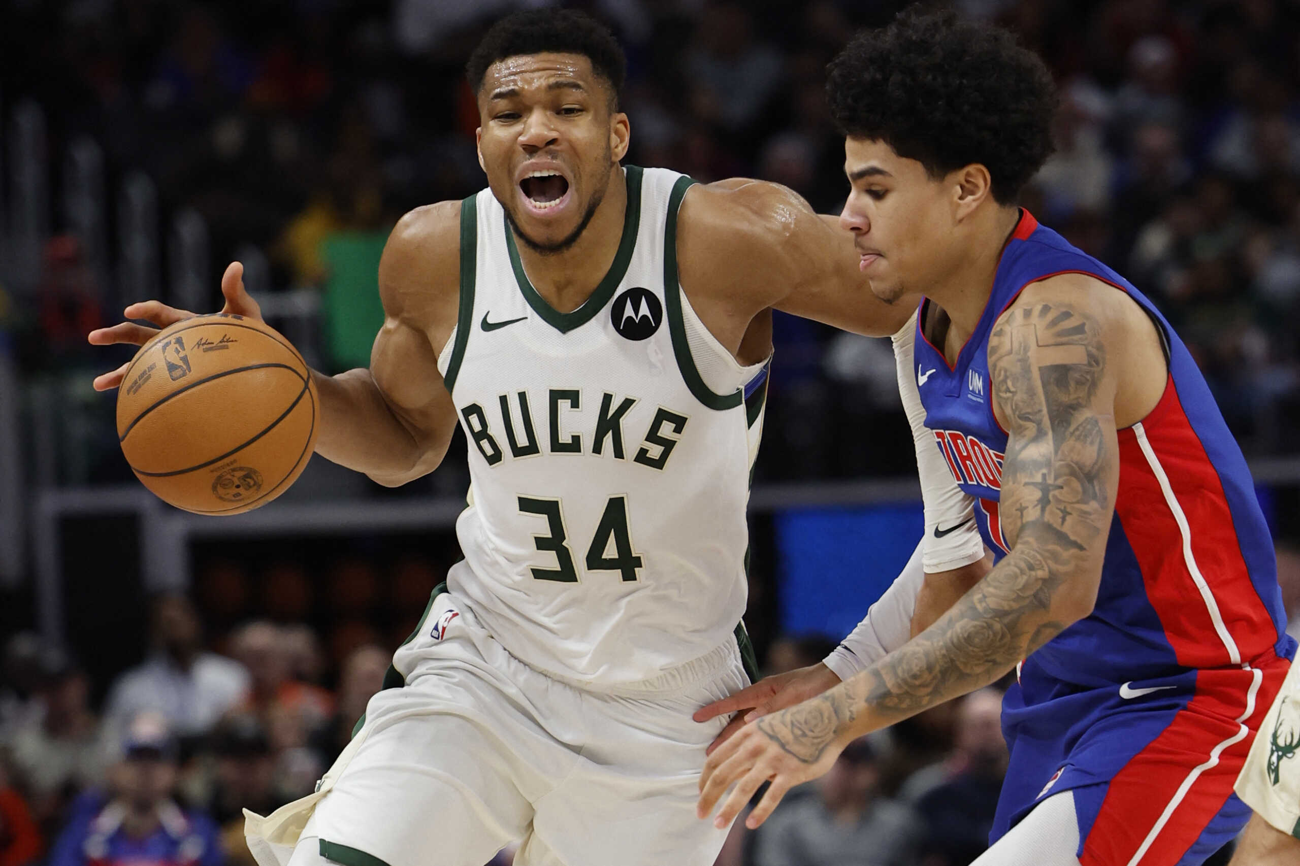 Jan 20, 2024; Detroit, Michigan, USA;  Milwaukee Bucks forward Giannis Antetokounmpo (34) dribbles defended by Detroit Pistons guard Killian Hayes (7) in the second half at Little Caesars Arena. Mandatory Credit: Rick Osentoski-USA TODAY Sports