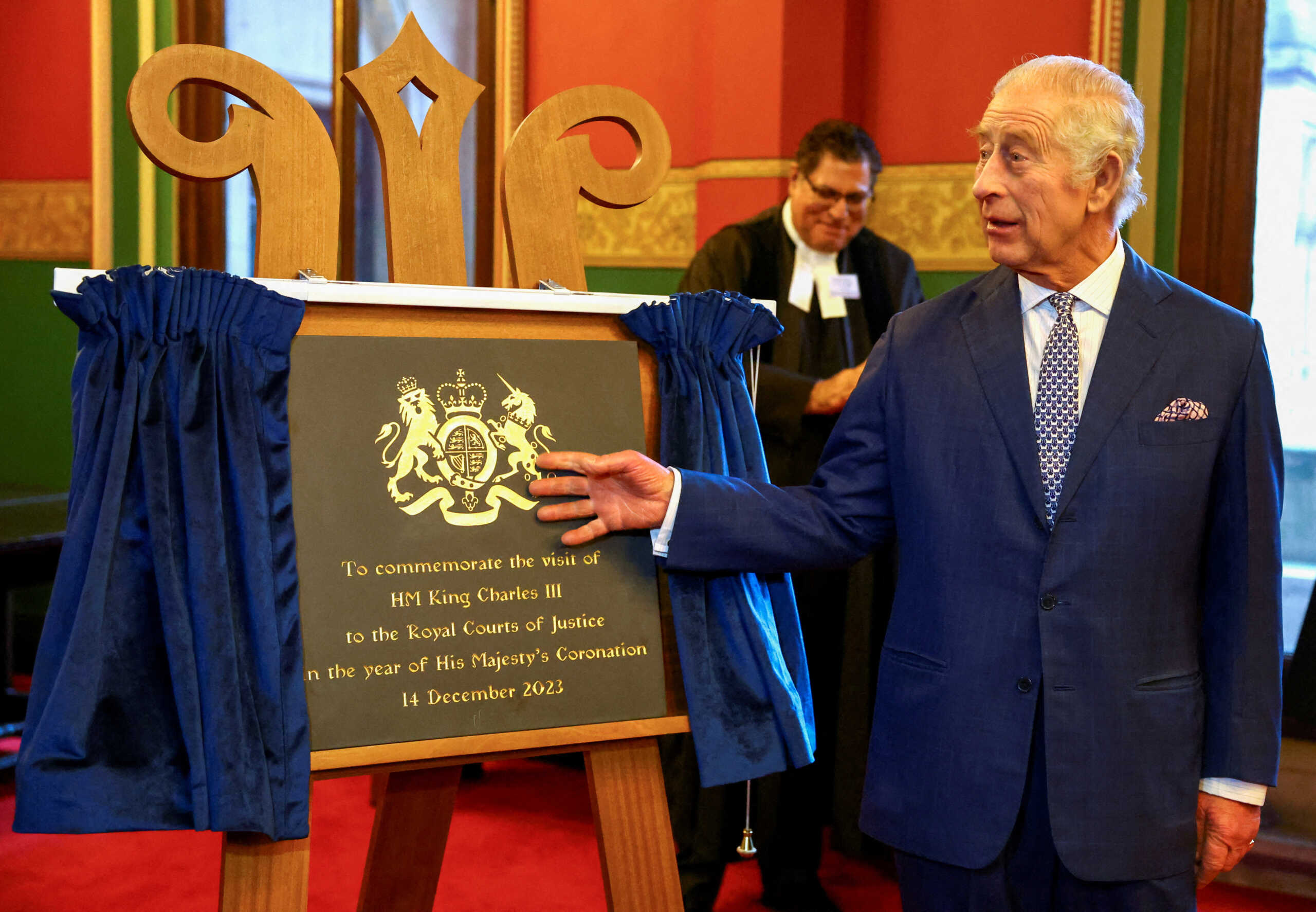 FILE PHOTO: Britain's King Charles unveils a plaque that commemorates his visit at the Royal Courts of Justice in London, Britain, December 14, 2023. REUTERS
