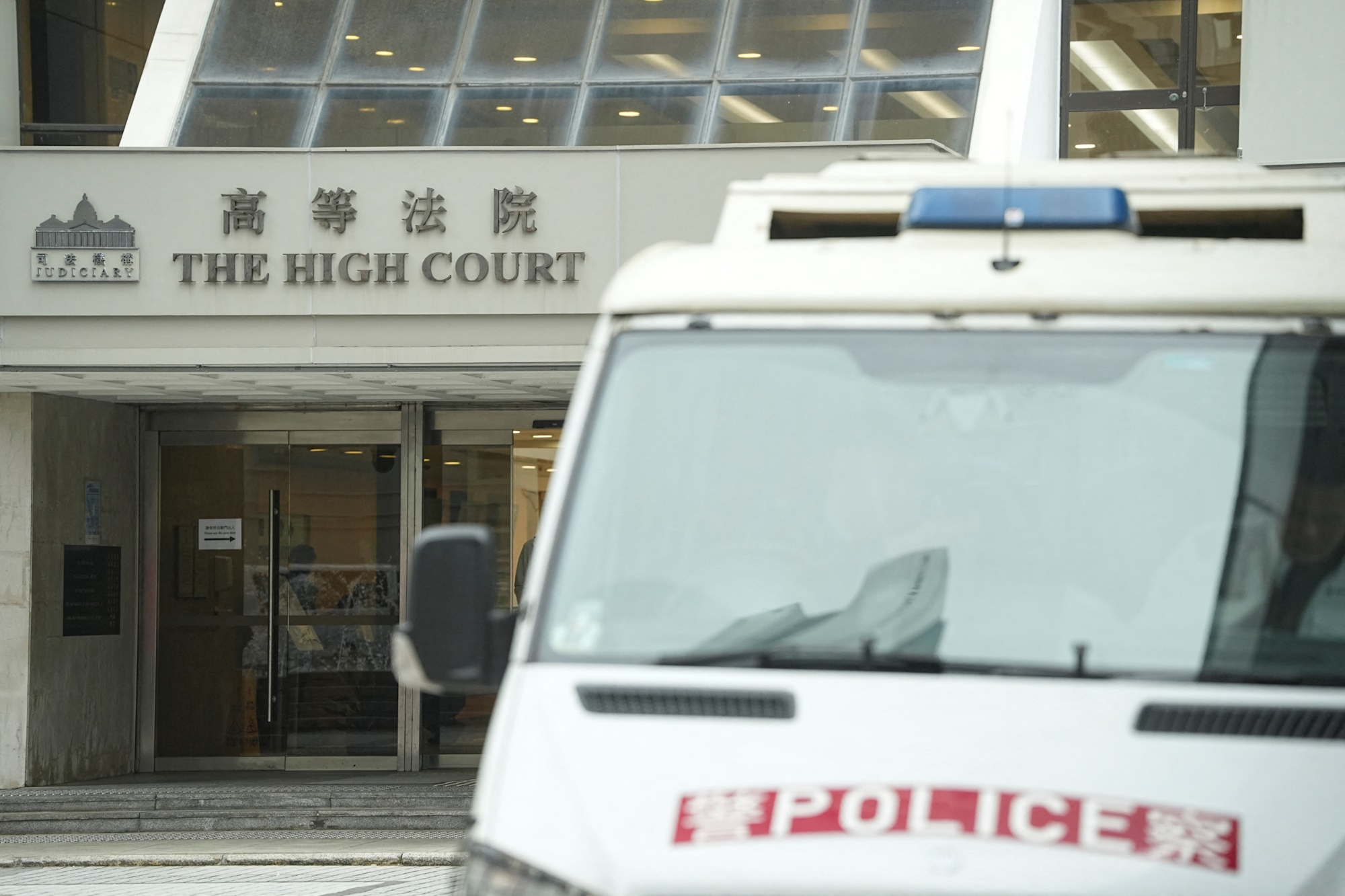 A police vehicle is pictured outside the High Court where a court hearing on property developer China Evergrande Group is held, in Hong Kong, China January 29, 2024. REUTERS