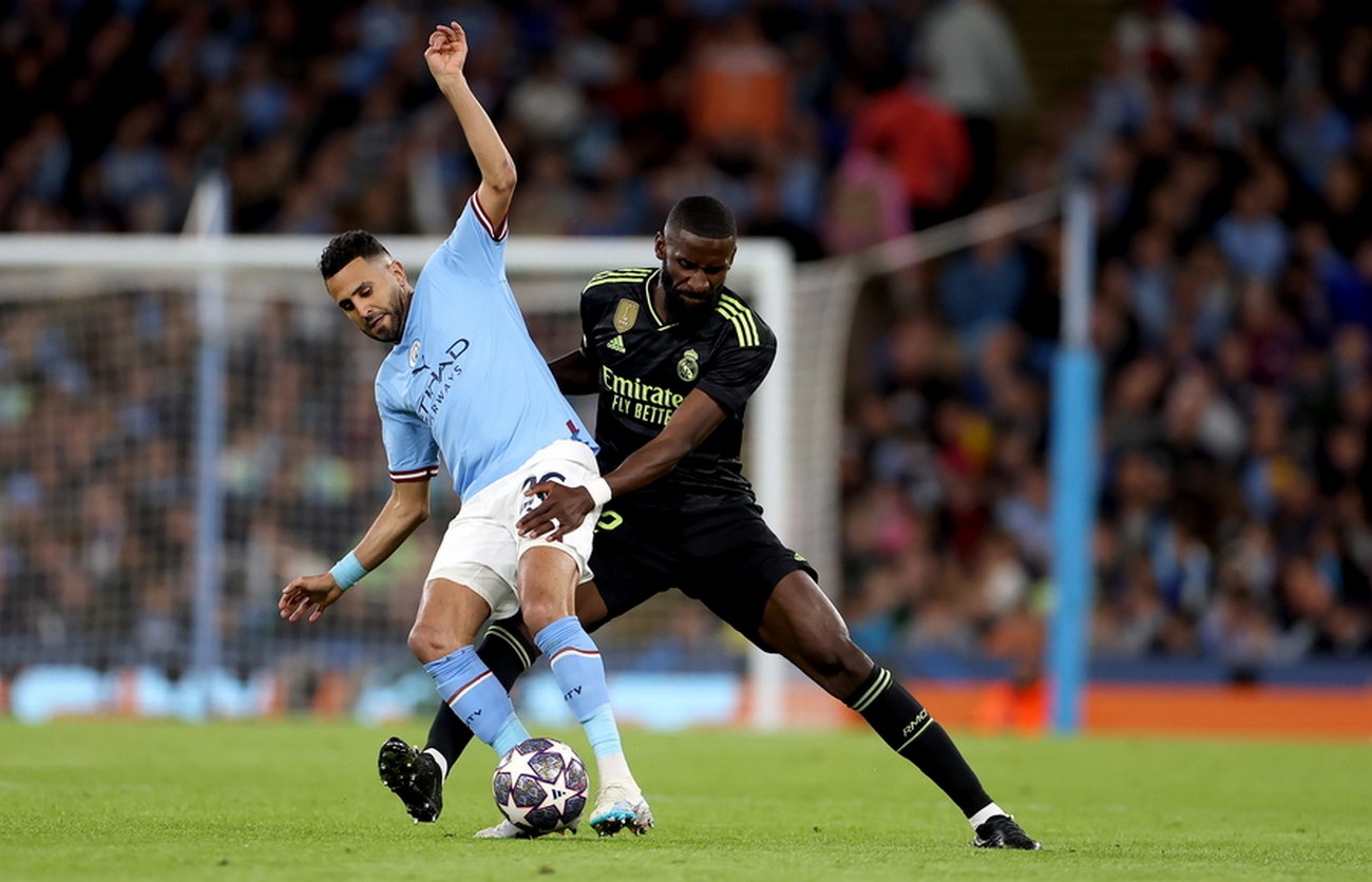 epa10635155 Riyad Mahrez (L) of Manchester City and Antonio Ruediger of Real Madrid in action during the UEFA Champions League semi-finals, 2nd leg soccer match between Manchester City and Real Madrid in Manchester, Britain, 17 May 2023.  EPA