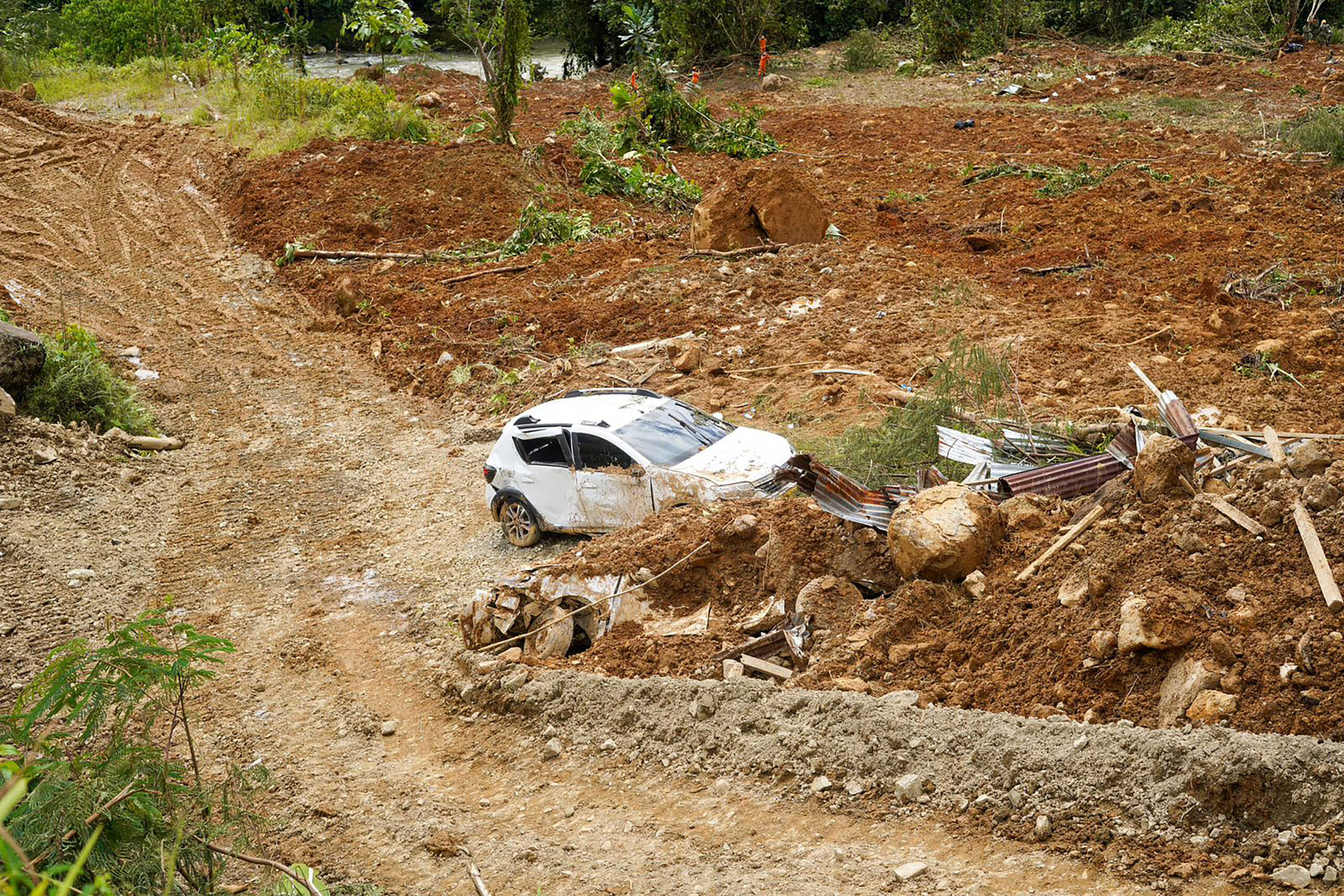 A view shows a damaged car amid debris in the aftermath of a landslide caused by heavy rains in Choco, Colombia January 13, 2024. Jean Arriaga