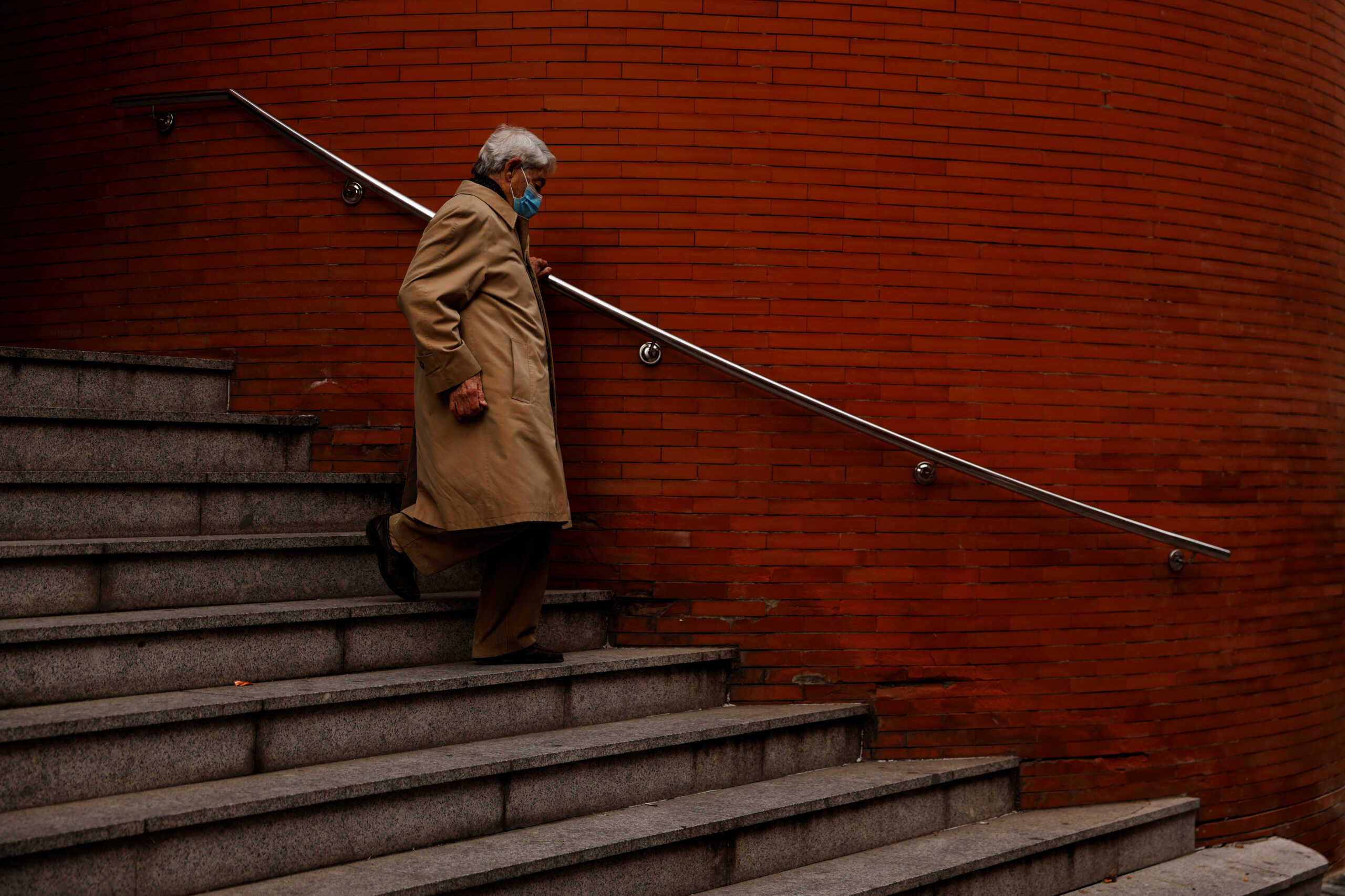 A man wearing a protective face mask leaves a health center in Madrid, Spain, January 10, 2024. REUTERS