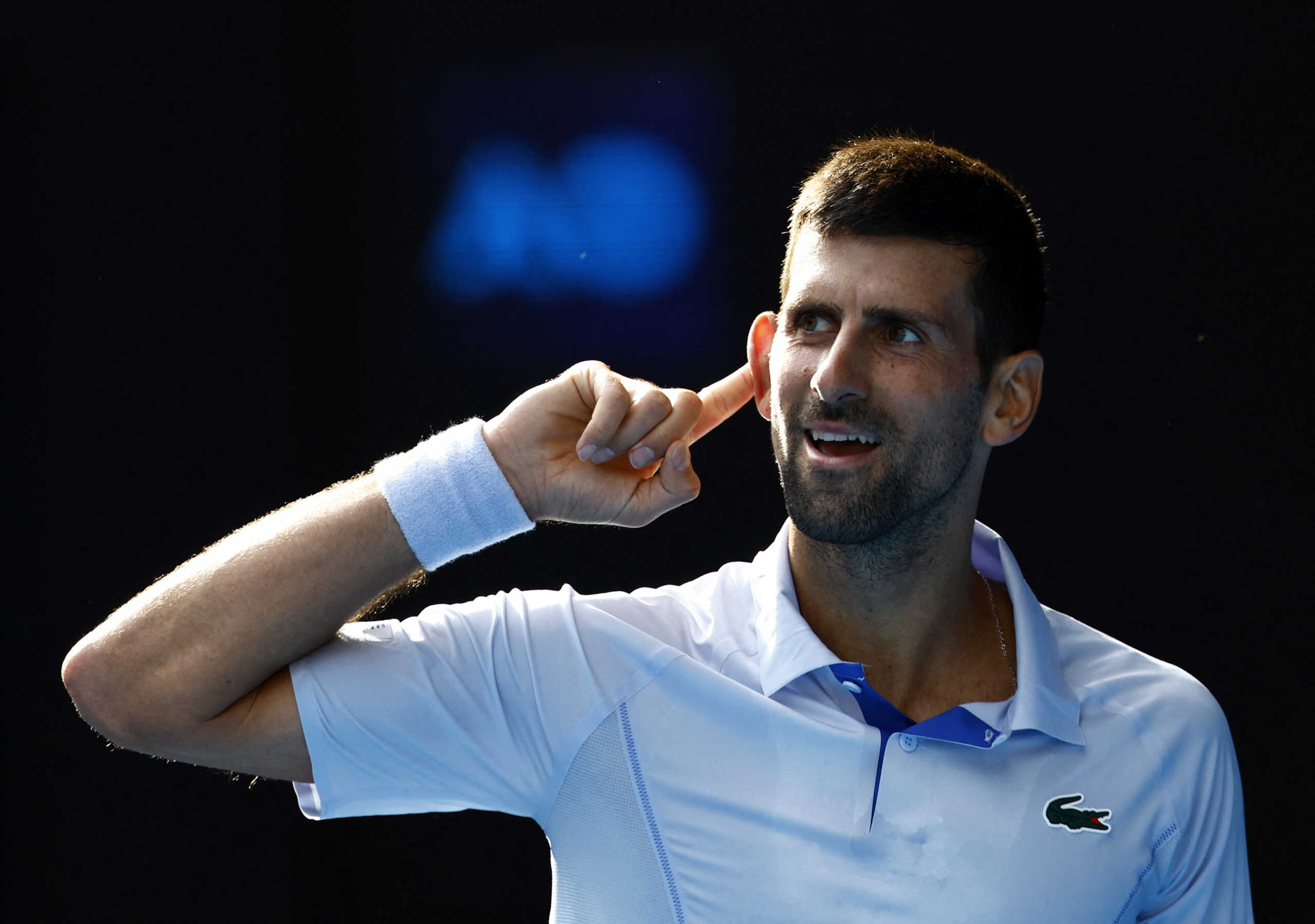 Tennis - Australian Open - Melbourne Park, Melbourne, Australia - January 23, 2024 Serbia's Novak Djokovic reacts during his quarter final match against Taylor Fritz of the U.S. REUTERS
