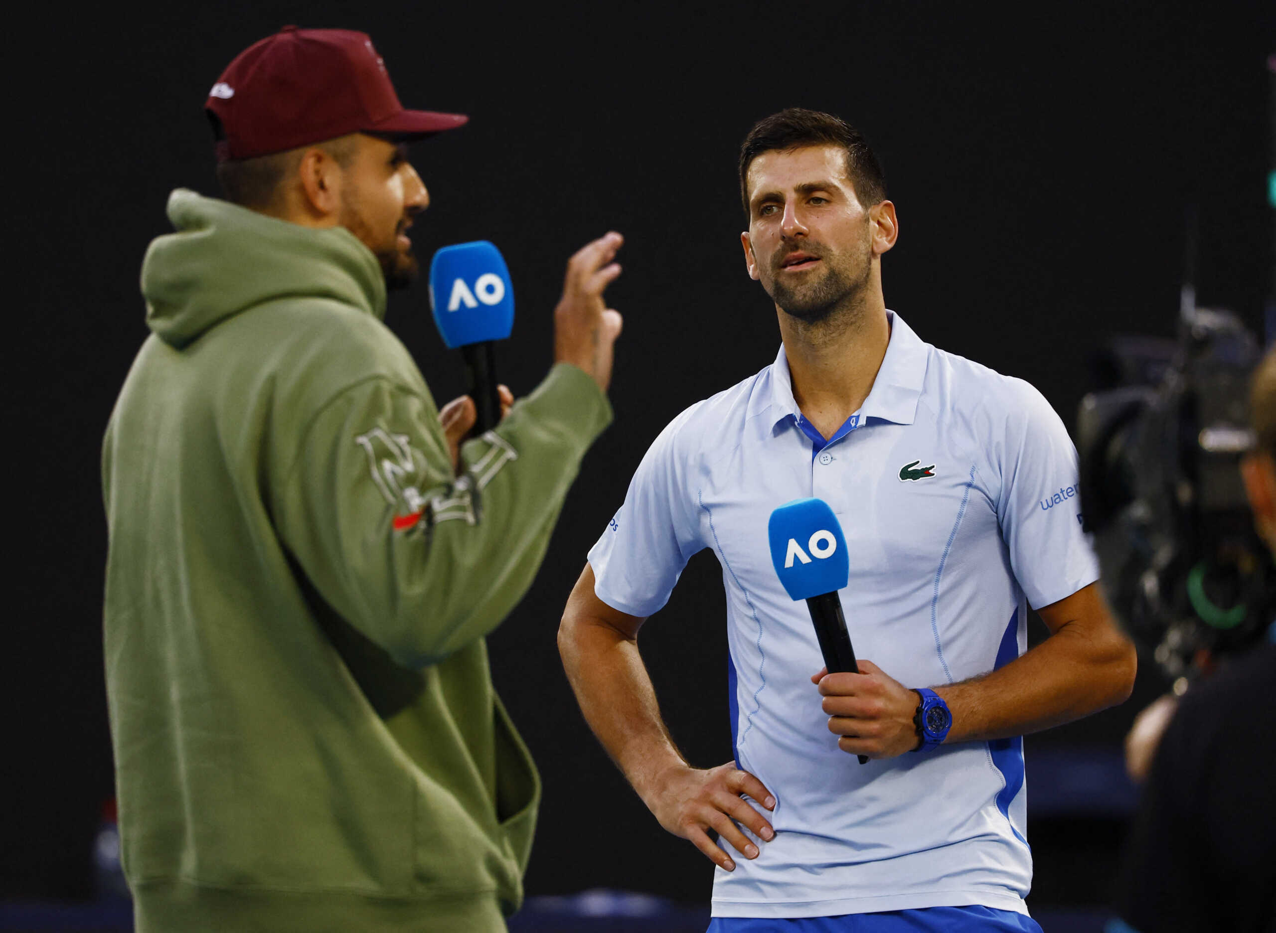 Tennis - Australian Open - Melbourne Park, Melbourne, Australia - January 23, 2024 Serbia's Novak Djokovic is interviewed by Australia's Nick Kyrgios after winning his quarter final match against Taylor Fritz of the U.S. REUTERS