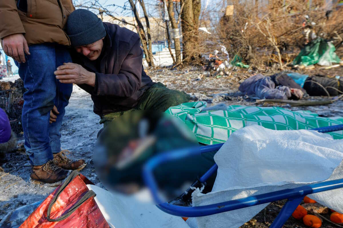 SENSITIVE MATERIAL. THIS IMAGE MAY OFFEND OR DISTURB A man mourns a victim following, what local Russian-installed authorities say, was a Ukrainian military strike at a food market in the course of Russia-Ukraine conflict in Donetsk, Russian-controlled Ukraine, January 21, 2024. REUTERS