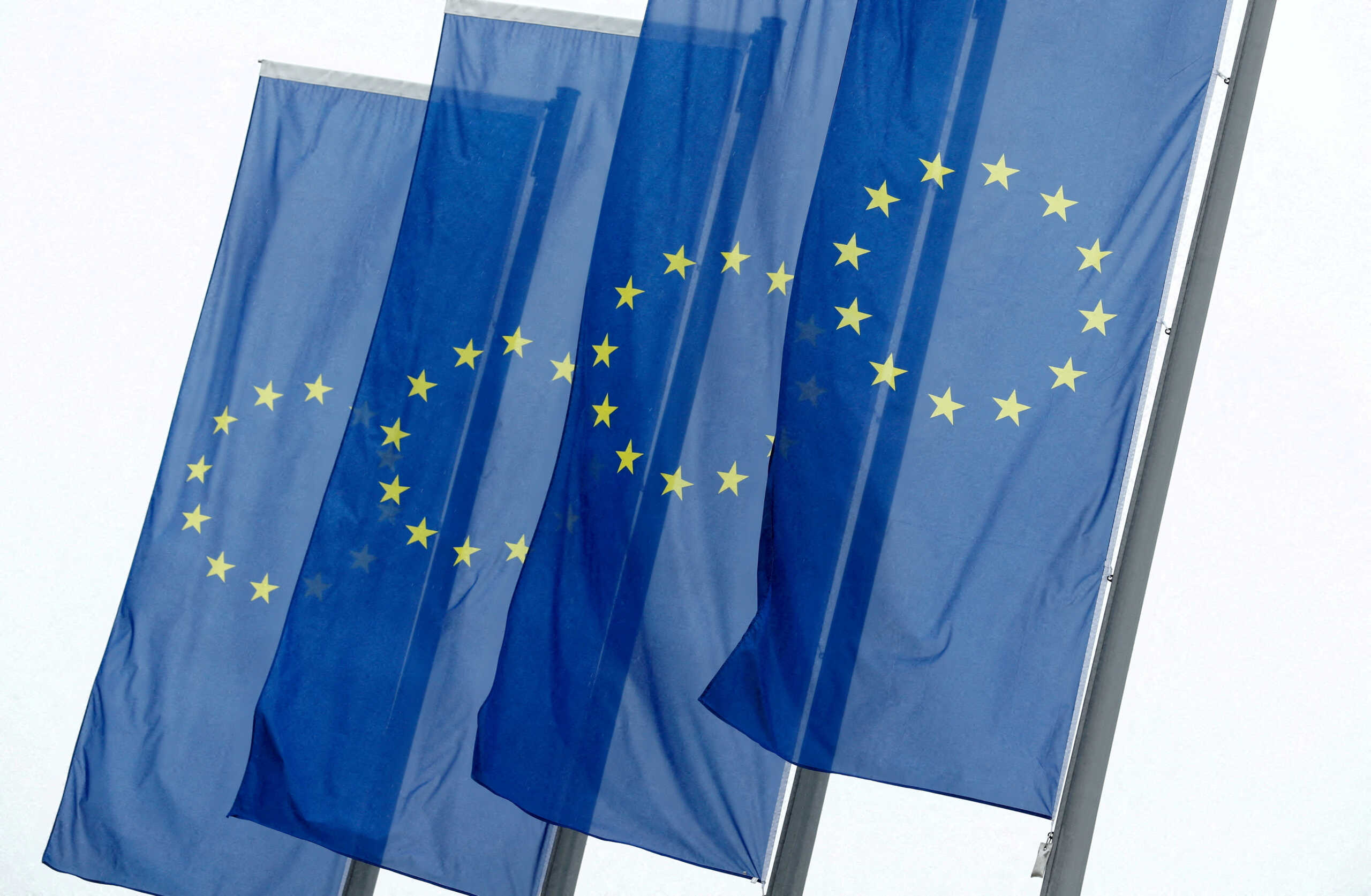 FILE PHOTO: FILE PHOTO: European Union flags fly in front of the headquarters of the European Central Bank in Frankfurt, Germany, July 8, 2020. REUTERS