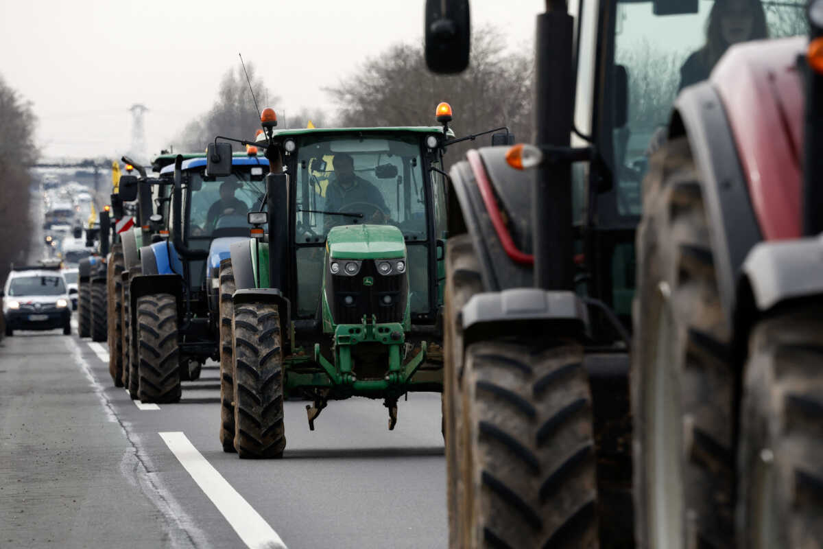 French farmers use their tractors during a go-slow operation near Roissy Charles-de-Gaulle airport as they protest over price pressures, taxes and green regulation, grievances shared by farmers across Europe, in Compans, near Paris, France, January 27, 2024. REUTERS