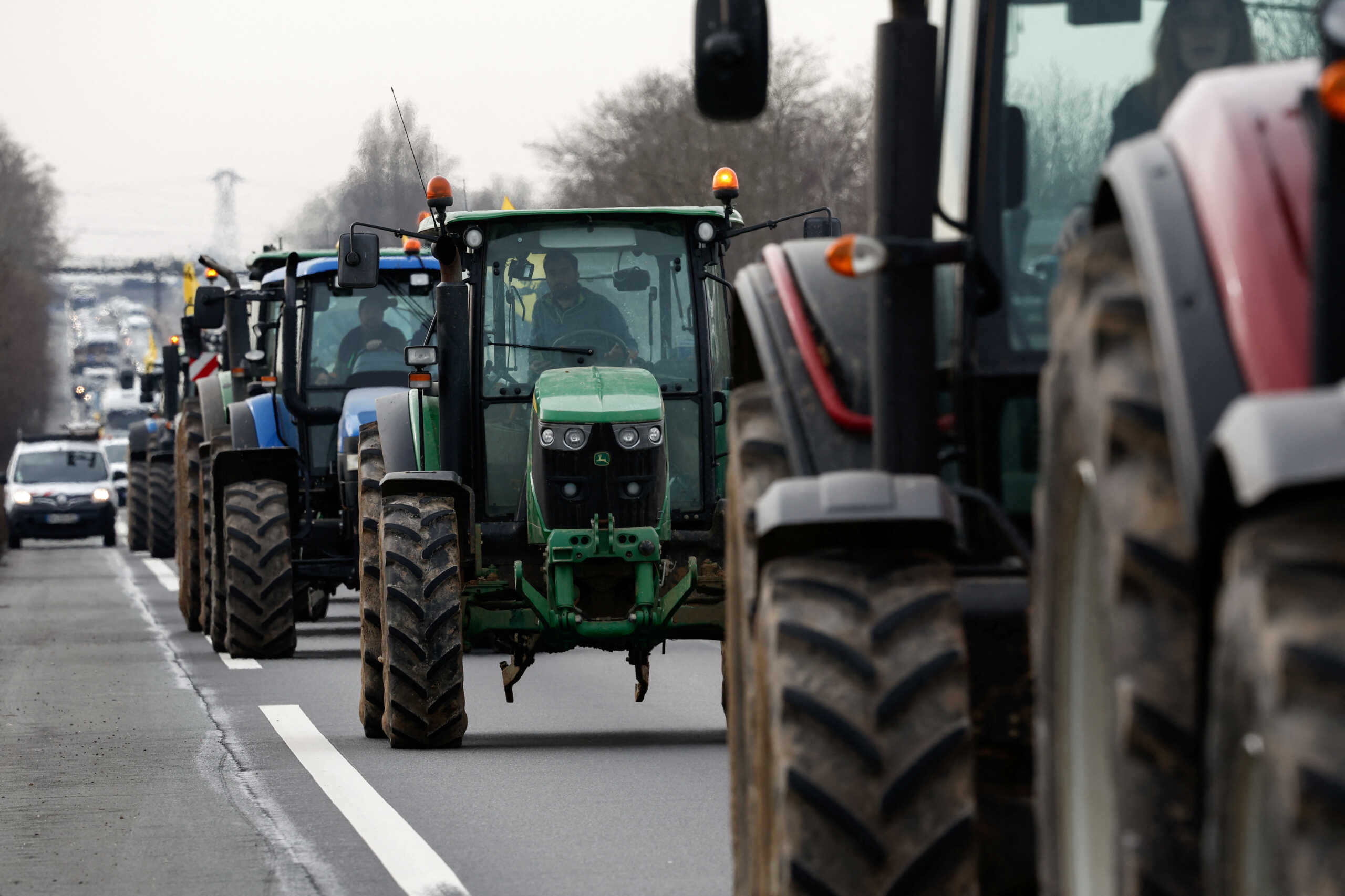 French farmers use their tractors during a go-slow operation near Roissy Charles-de-Gaulle airport as they protest over price pressures, taxes and green regulation, grievances shared by farmers across Europe, in Compans, near Paris, France, January 27, 2024. REUTERS