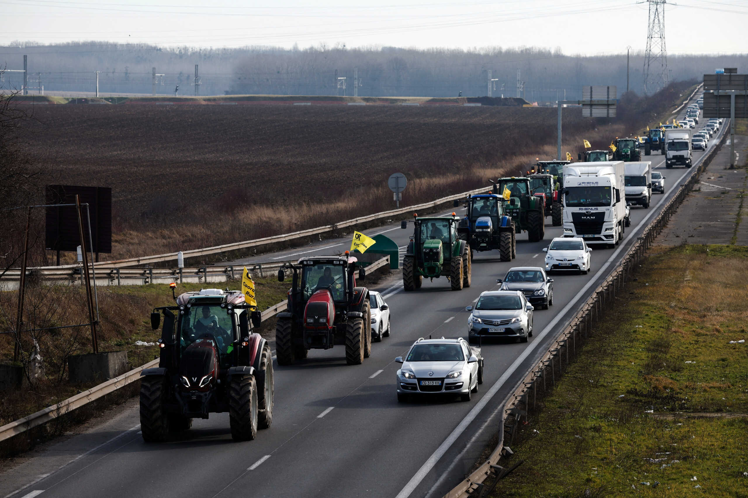 French farmers use their tractors during a go-slow operation near Roissy Charles-de-Gaulle airport as they protest over price pressures, taxes and green regulation, grievances shared by farmers across Europe, in Compans, near Paris, France, January 27, 2024. REUTERS
