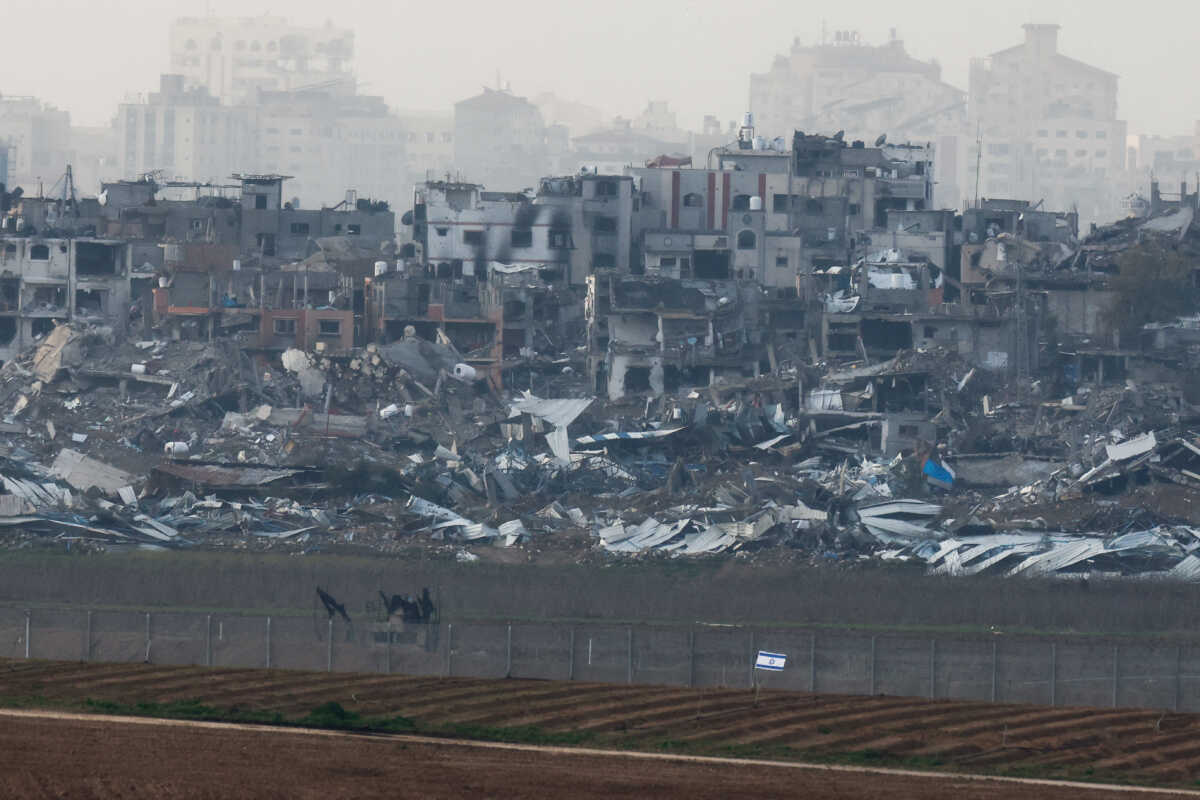 Buildings lie in ruin in Gaza, amid the ongoing conflict between Israel and the Palestinian Islamist group Hamas, as seen from Israel, January 14, 2024. REUTERS