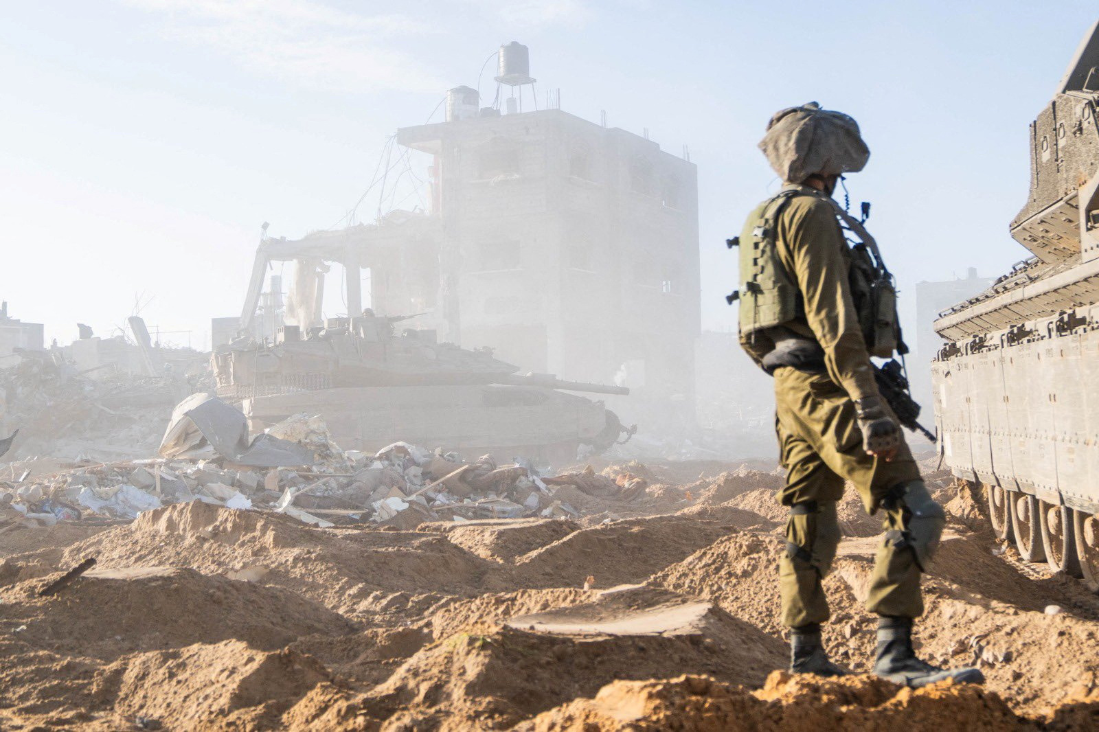 An Israeli soldier operates in the Gaza Strip amid the ongoing conflict between Israel and the Palestinian Islamist group Hamas, in this handout picture released December 30, 2023. Israel Defense Forces