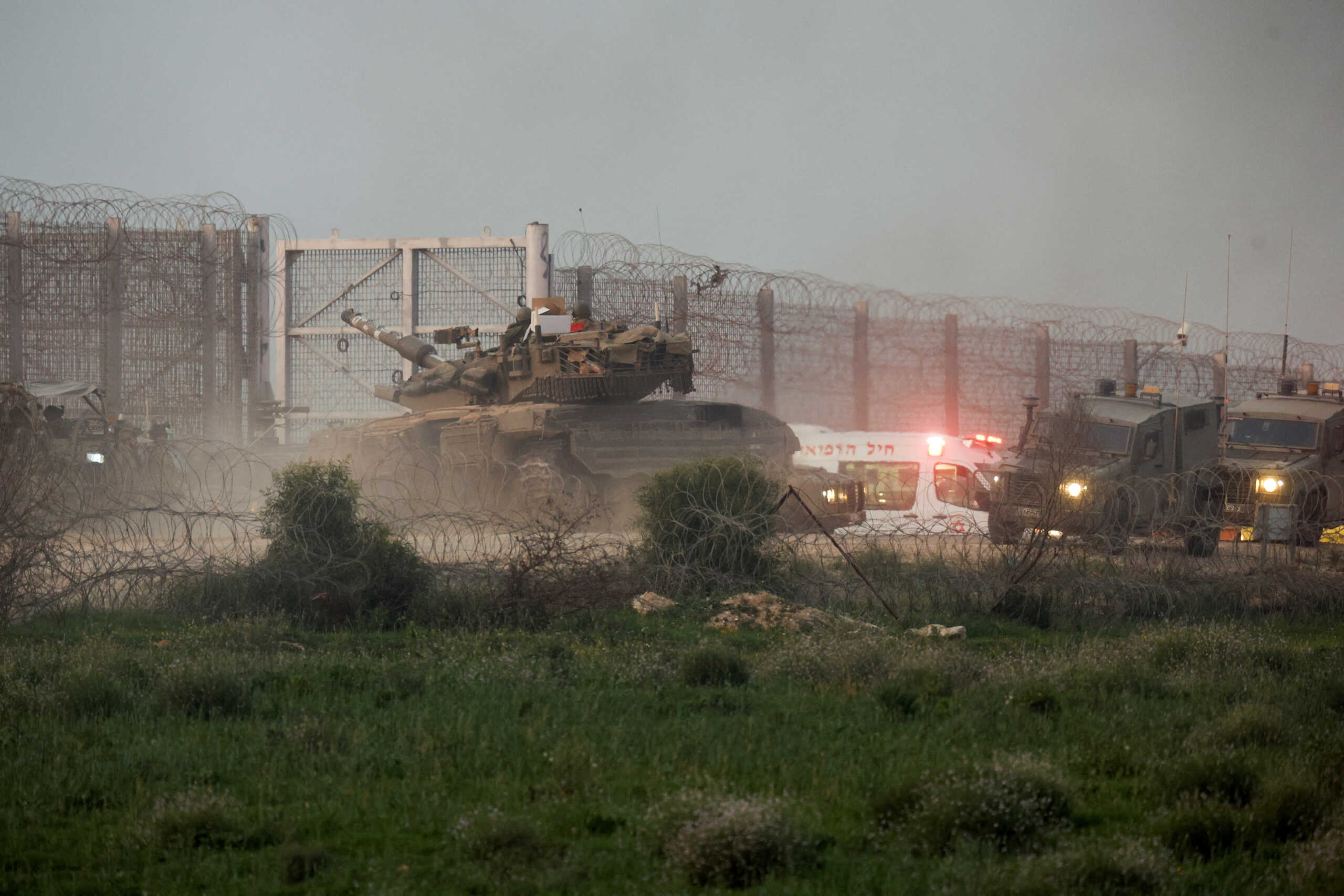 A tank manoeuvres along the Israel-Gaza border fence, amid the ongoing conflict between Israel and the Palestinian Islamist group Hamas, in Israel January 22, 2024. REUTERS