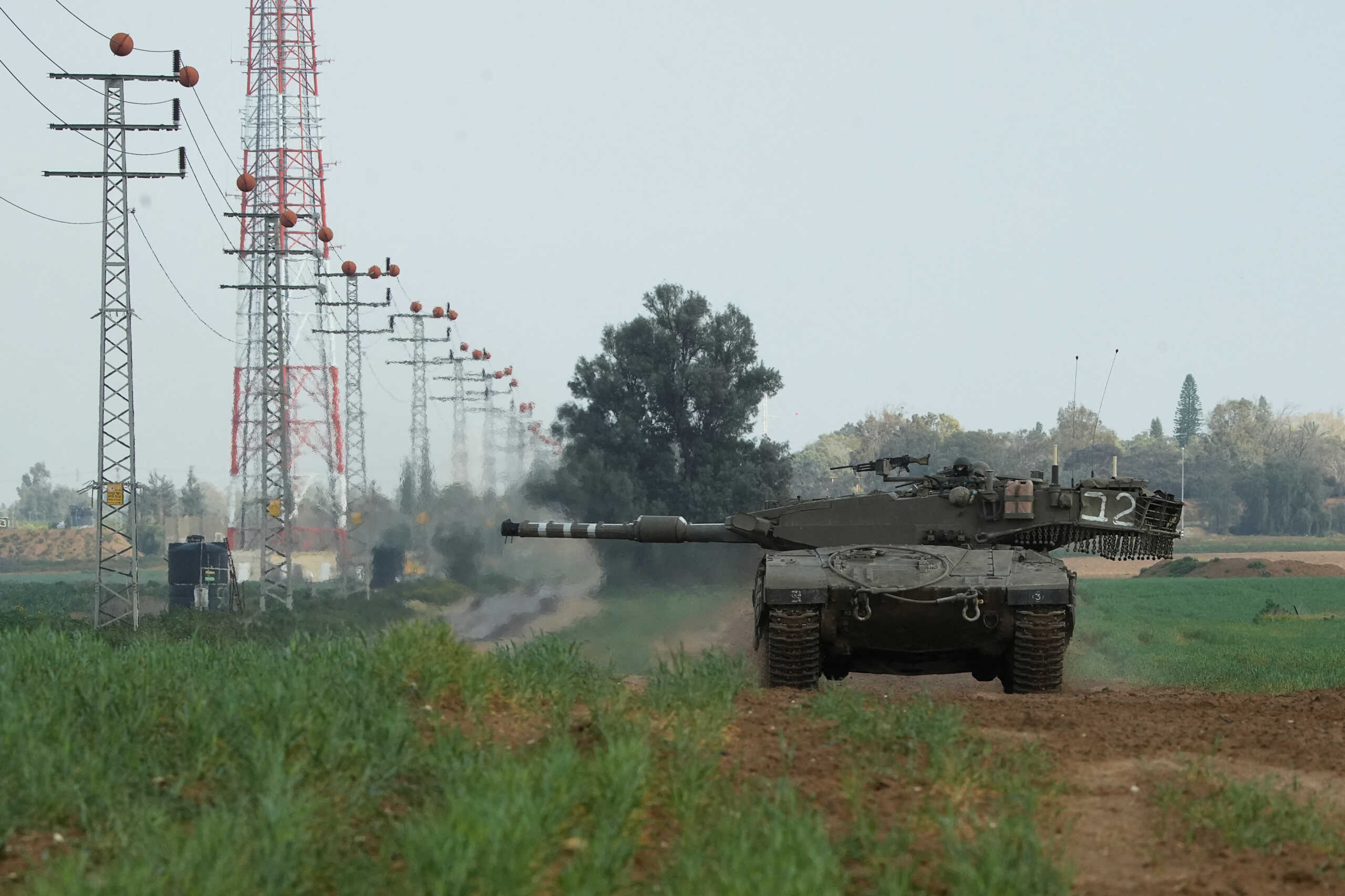 An Israeli tank manoeuvres near the Israel-Gaza border, amid the ongoing conflict between Israel and the Palestinian Islamist group Hamas, in Israel, January 27, 2024. REUTERS