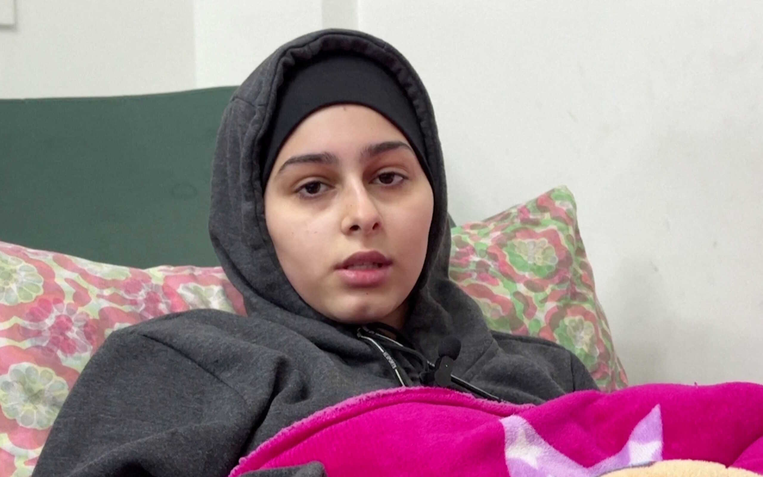 A'hed Bseiso, a Palestinian girl whose leg was amputated at home without anaesthesia, speaks during an interview with Reuters nearly a month after the procedure, in Gaza City, Gaza, January 17, 2024 in this screen grab from a video. Reuters TV