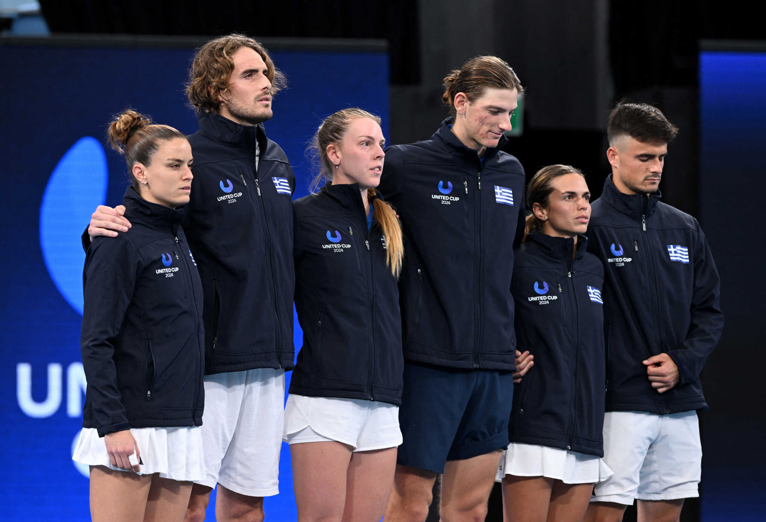 Tennis - United Cup - Ken Rosewall Arena, Sydney, Australia - January 5, 2024 Greece's Maria Sakkari, Stefanos Tsitsipas, Despina Papamichail, Stefanos Sakellaridis, Valentini Grammatikopoulou and Petros Tsitsipas line up before their quarterfinal matches against Germany REUTERS