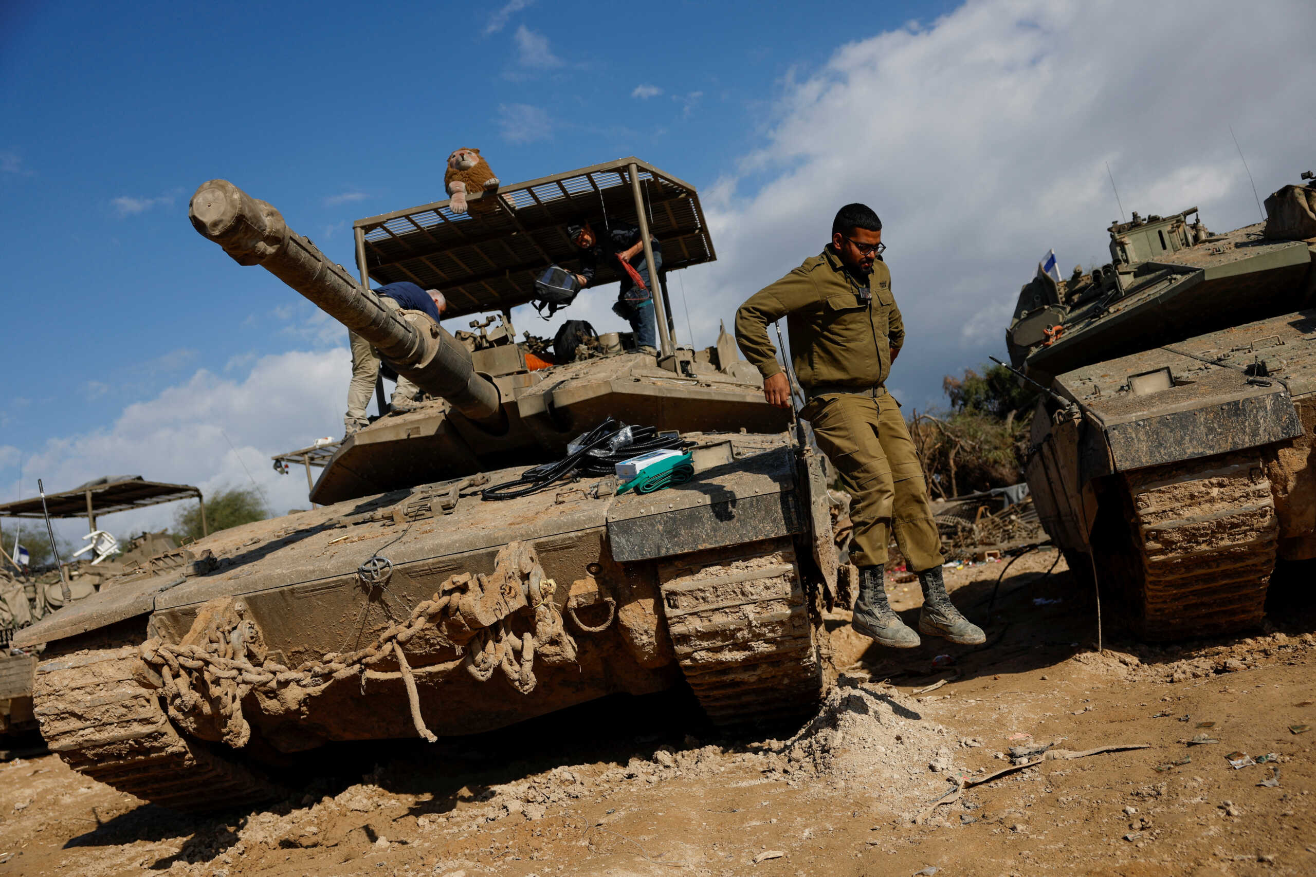 An Israeli soldier jumps from a tank, amid the ongoing conflict between Israel and the Palestinian Islamist group Hamas, near the border with northern Gaza, in Israel, January 5, 2024. REUTERS