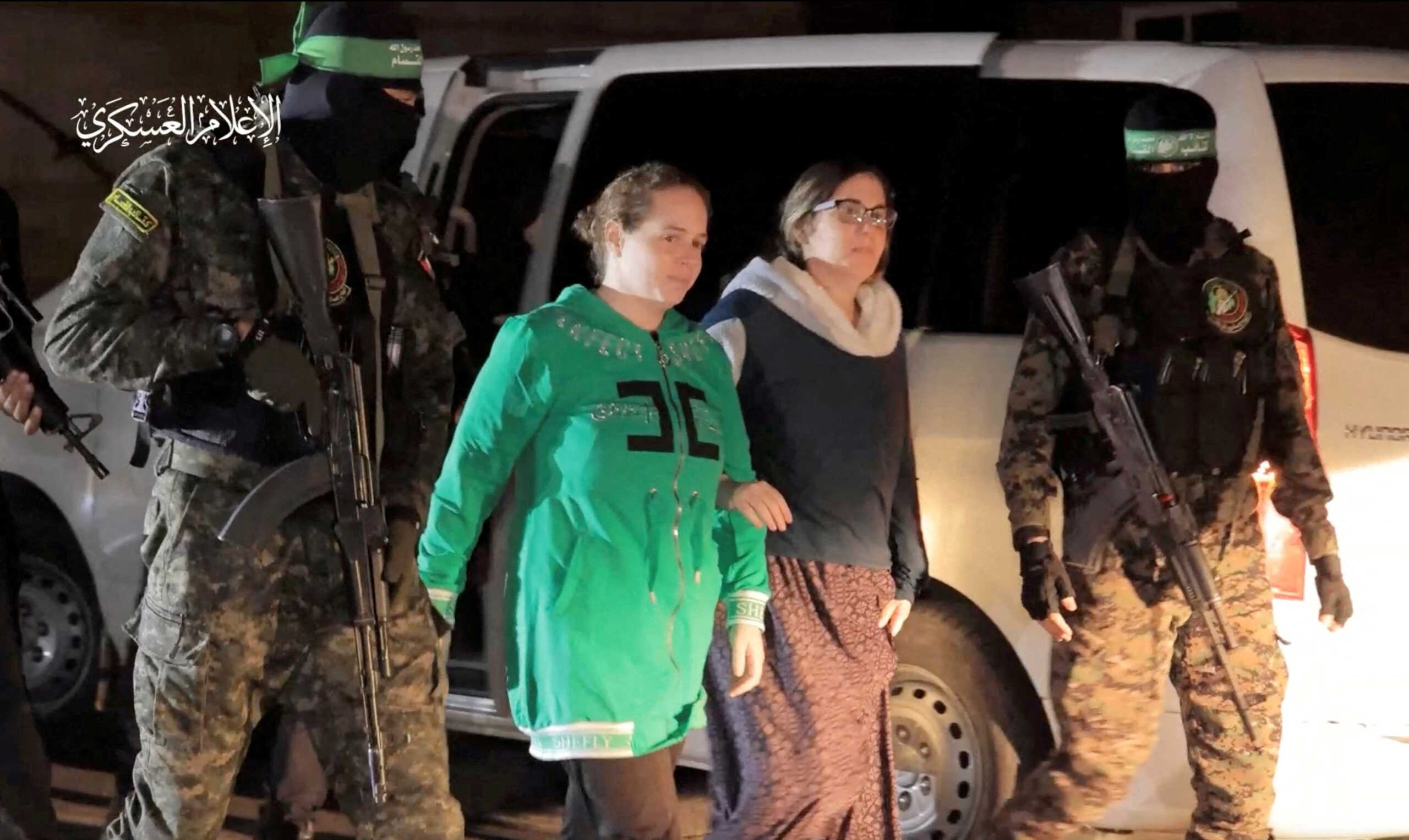 FILE PHOTO: Nili Margalit and Shani Goren, hostages who were abducted by Hamas gunmen during the October 7 attack on Israel, are handed over by Hamas militants to the International Red Cross, as part of a hostages-prisoners swap deal between Hamas and Israel amid a temporary truce, in an unknown location in the Gaza Strip, November 30, 2023. Hamas Military Wing