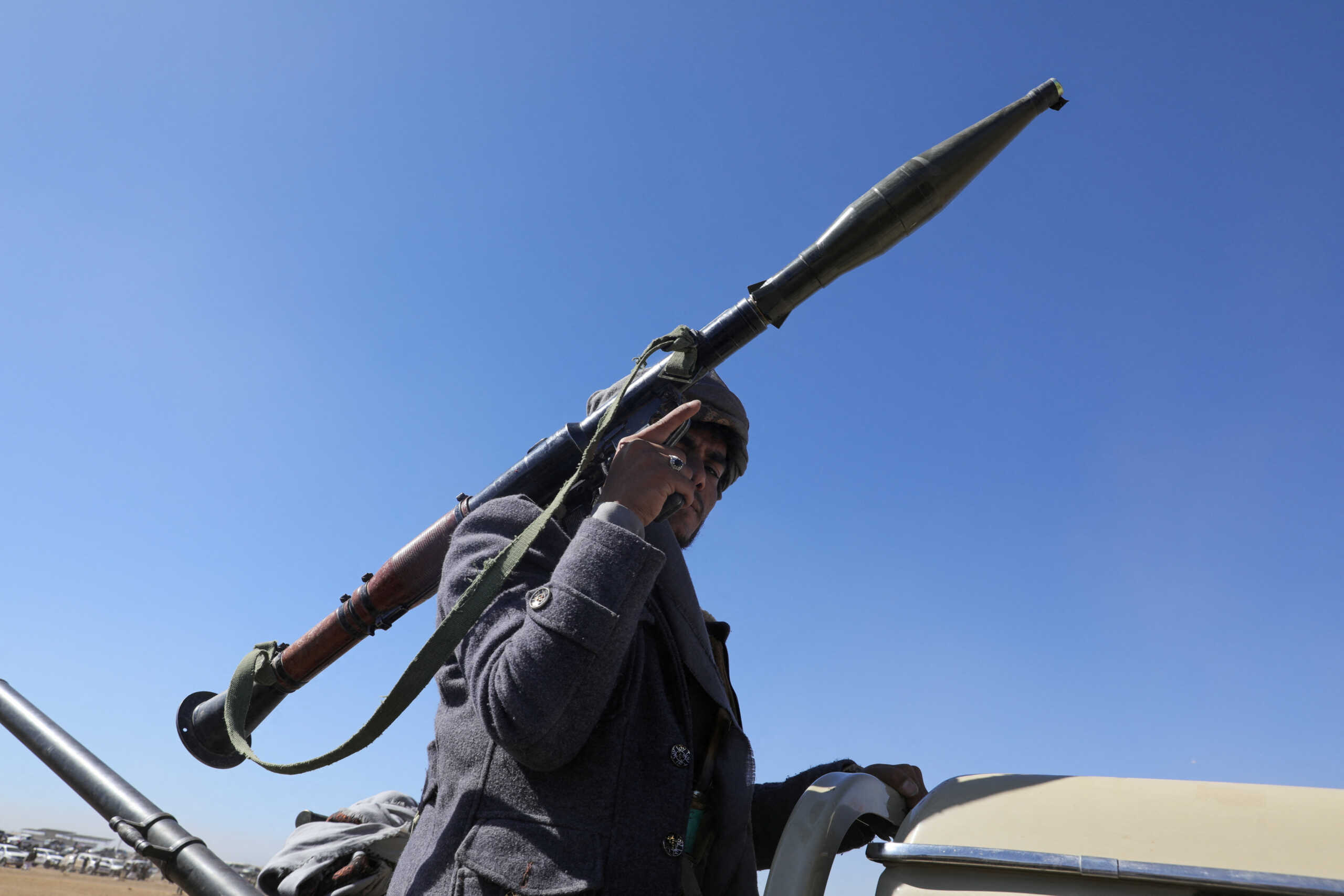 A tribal supporter of Yemen's Houthis carries an RPG launcher during a protest against recent U.S.-led on against Houthi targets, near Sanaa, Yemen January 14, 2024. REUTERS