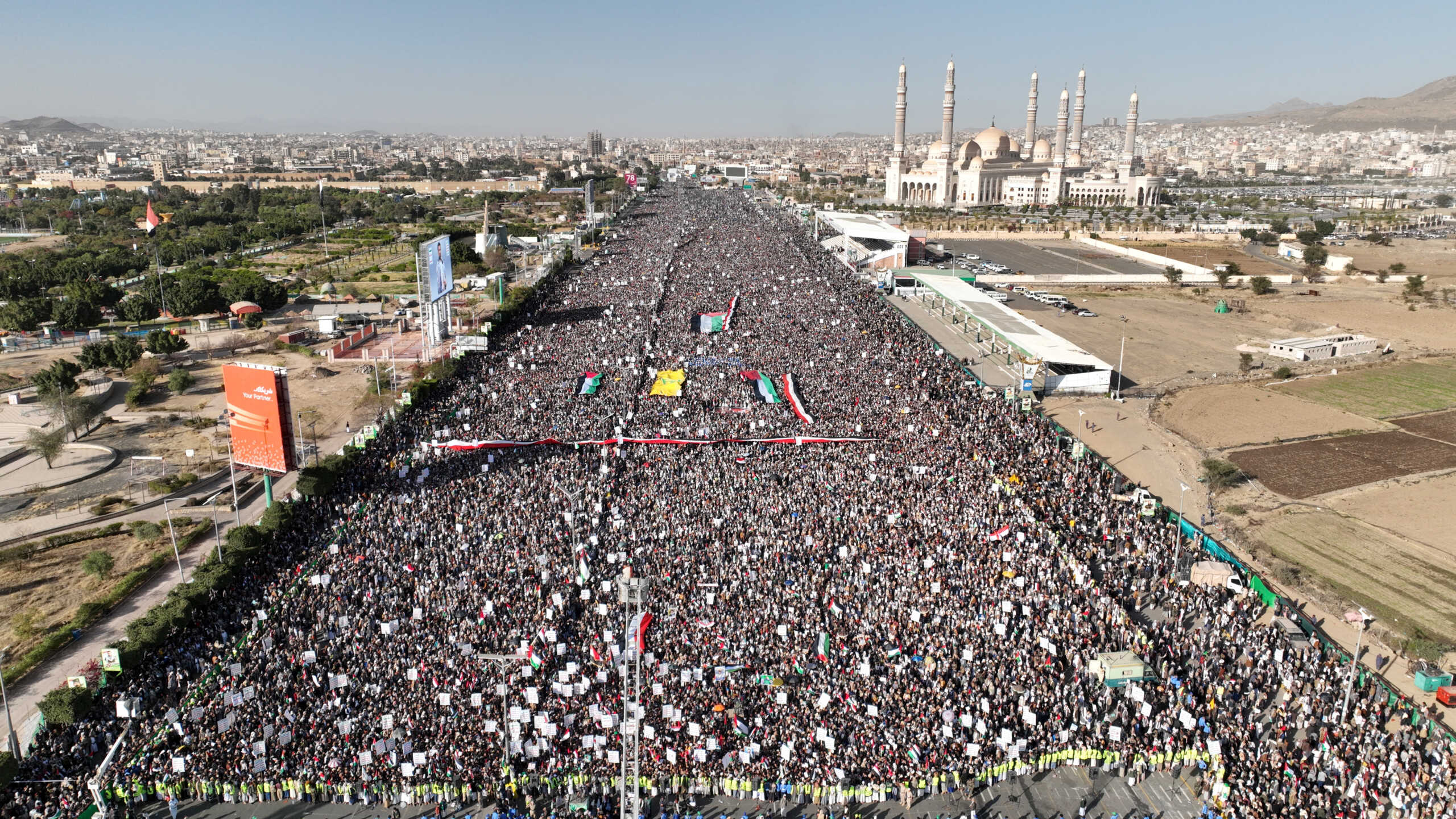 A drone view as Houthi movement supporters rally to denounce air strikes launched by the U.S. and Britain on Houthi targets, in Sanaa, Yemen January 12, 2024. Houth Media Center