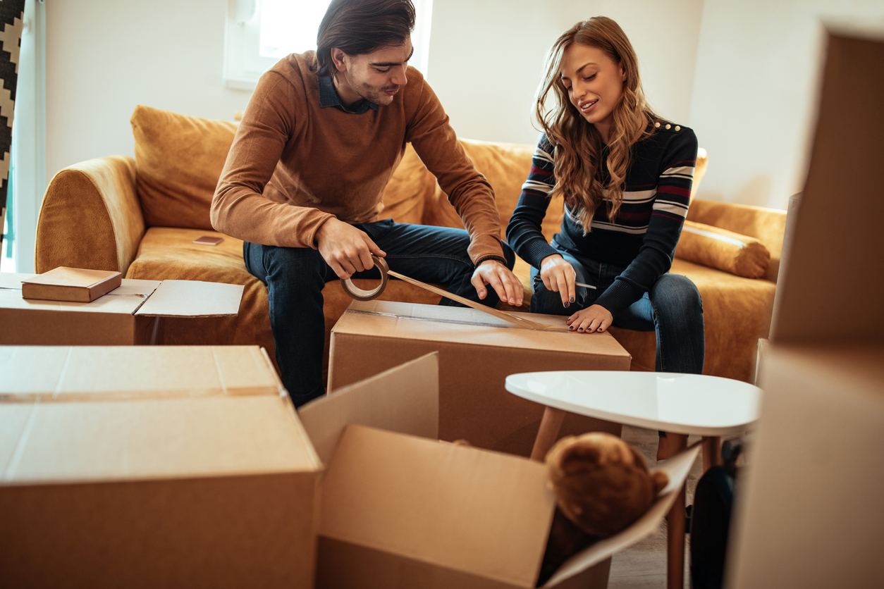 Shot of an affectionate couple moving into a new place