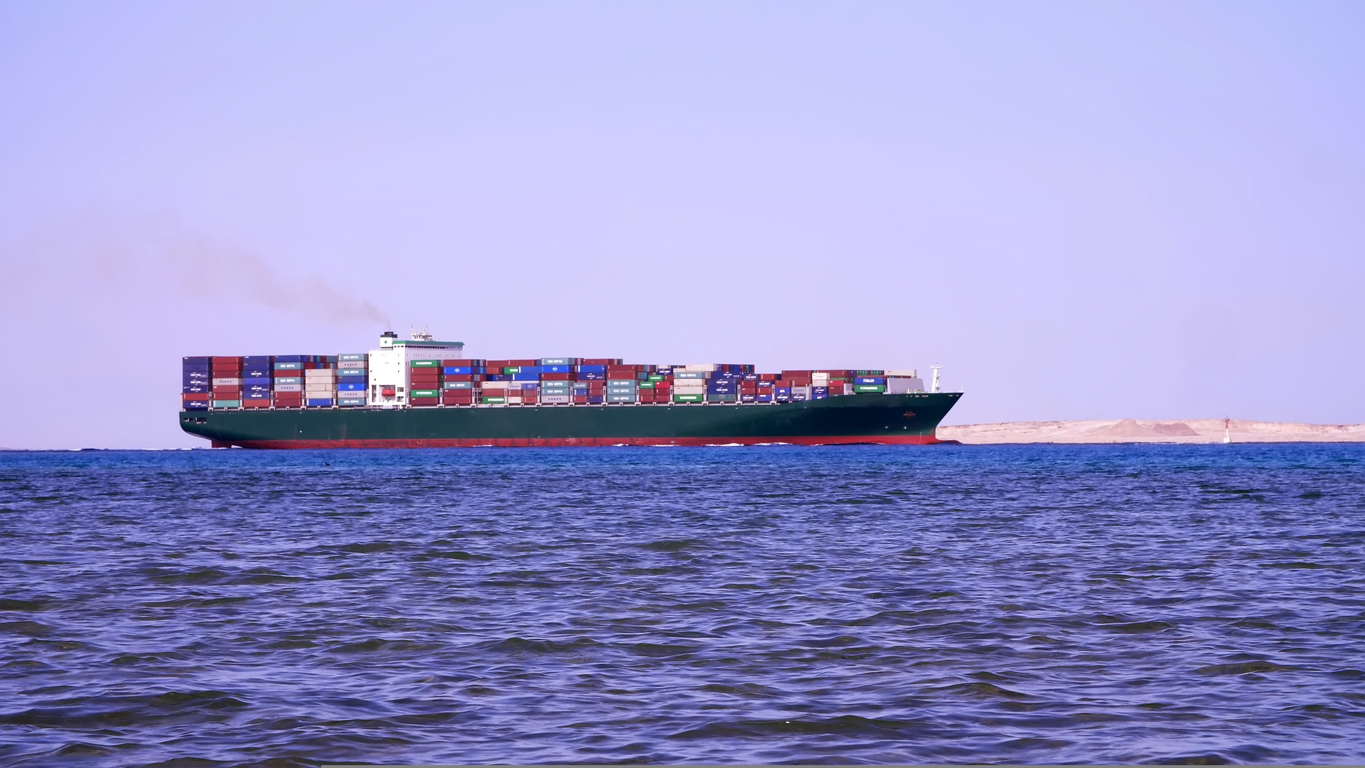 SHARM EL SHEIKH, EGYPT - APRIL 5, 2018 : Red sea, a large cargo ship sails on the sea. High quality photo