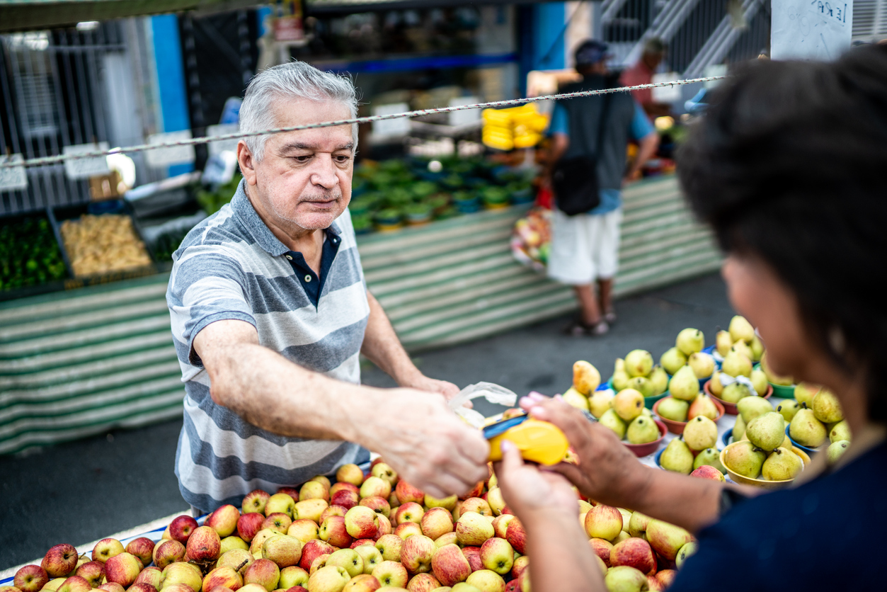 Customer paying with credit card on a street market