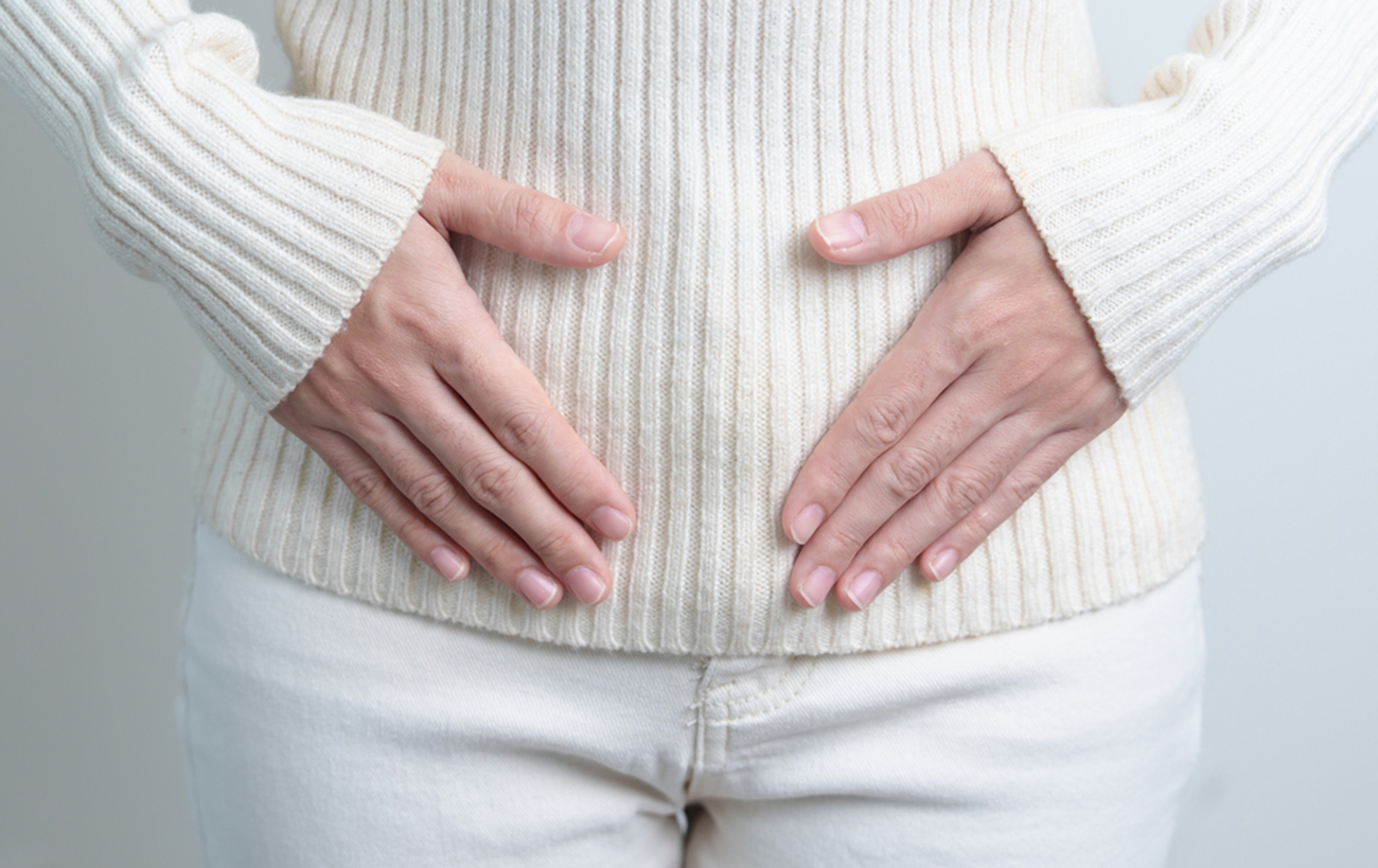 Woman holding  her belly. Pregnancy, Reproductive system, menstruation, and gynecology concept