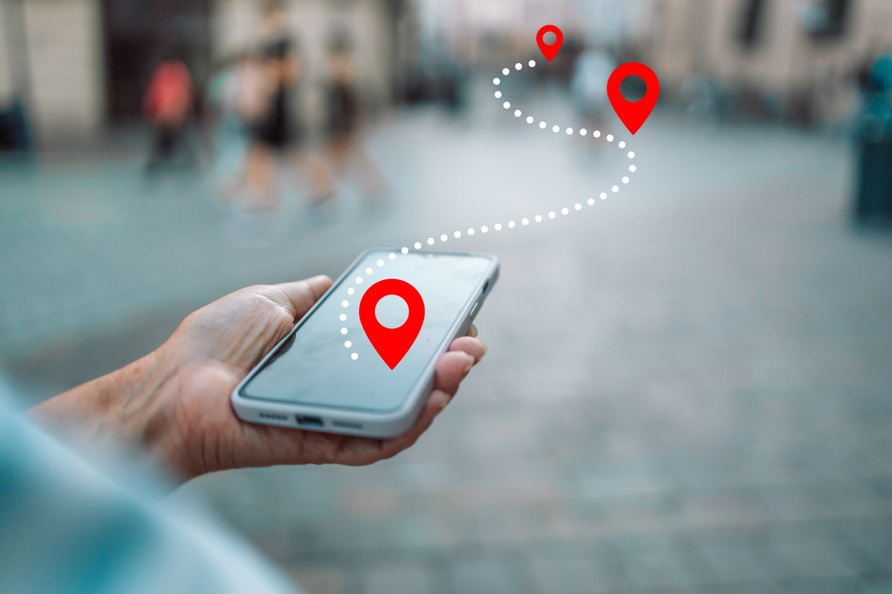 Tourist using navigation app on the mobile phone. High quality photo