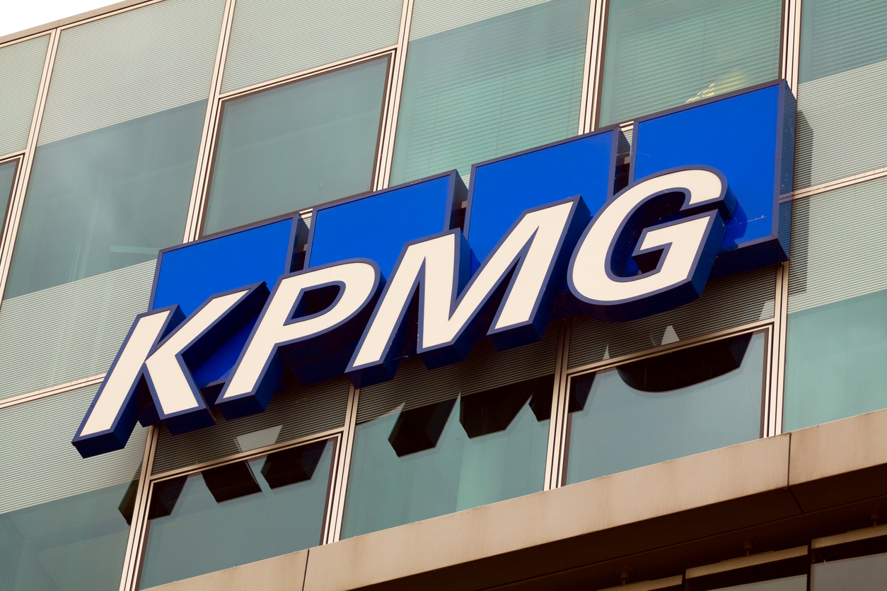 "Berlin, Germany - May, 27th 2011: Brand and logo of accountant, auditing firm and company KPMG International Cooperative in Berlin. Letters stands for founding members between 1870 and 1917: Klynveld, Peat, Marwick and Goerdeler. KPMG is one of big four auditing firms in world. KPMG has several locations in gretaer cities in Germany, Office in Berlin is in street KlingelhAferstrae."