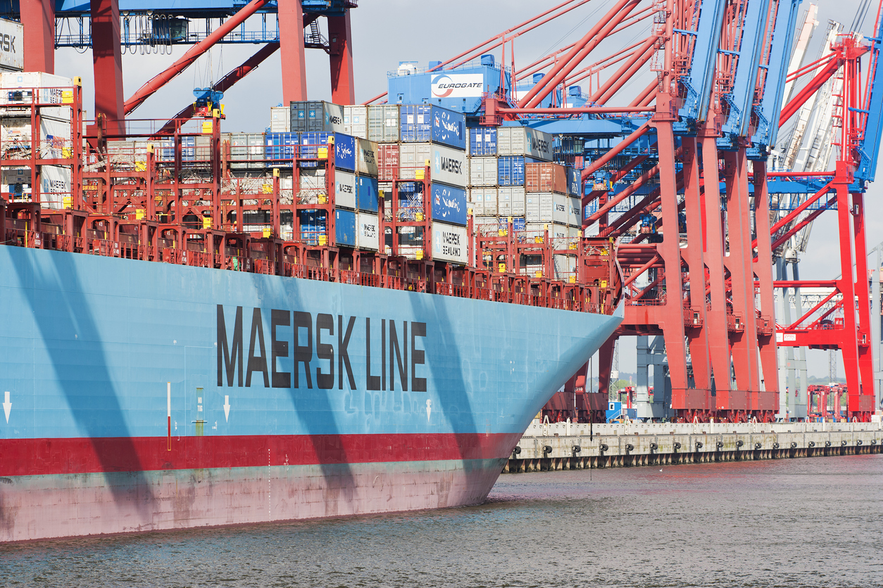 Hamburg, Germany - May 14, 2013: A container ship in the famous container terminal of Hamburg- Waltershof. Huge cranes of the Eurokai are working very well-organised to unload the containers in a short time. In front the huge Container ship "Maersk Antares" from Maersk lines. Hamburg has got the second biggest harbour in Europe.
