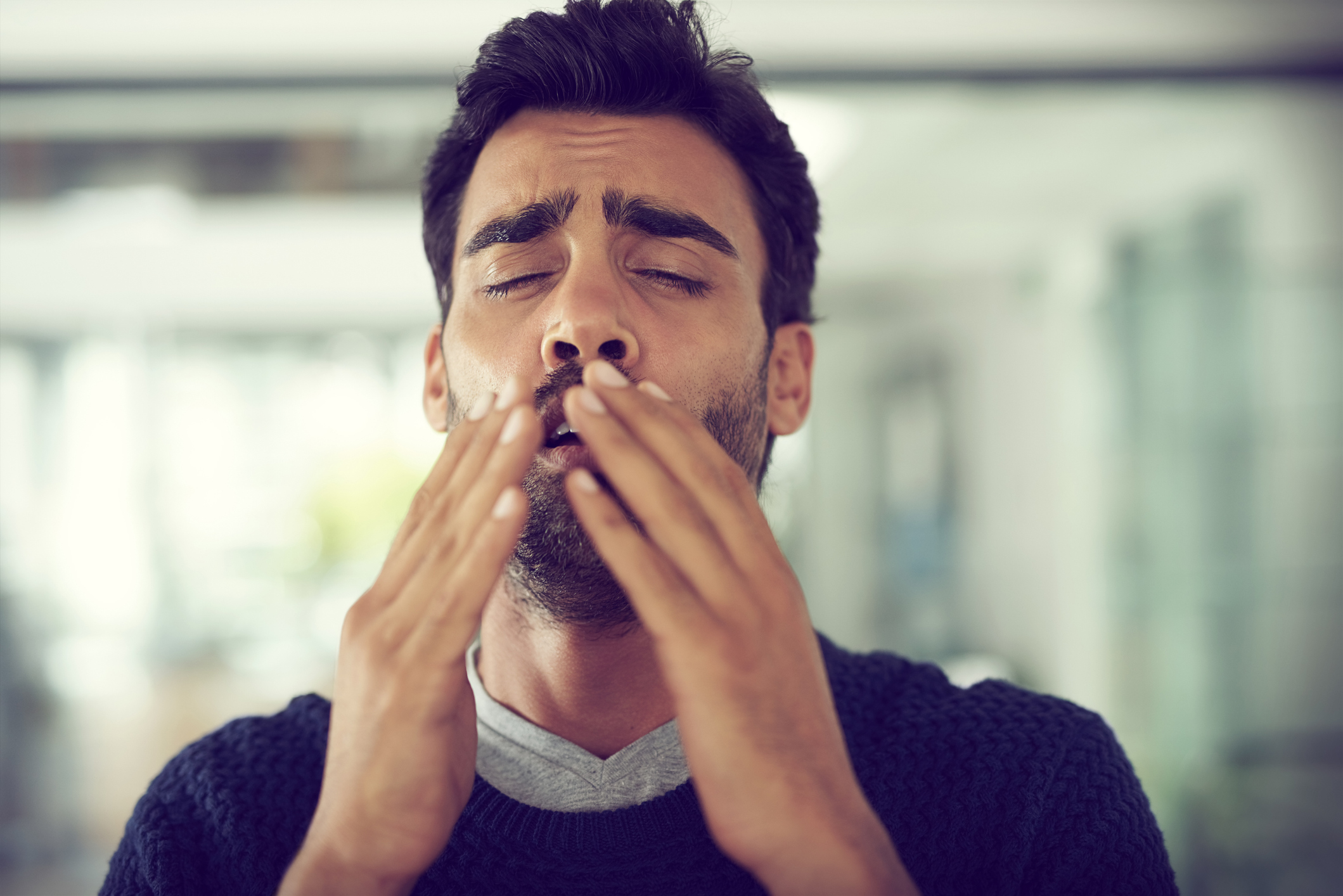 Cropped shot of a designer suffering with allergies in an office